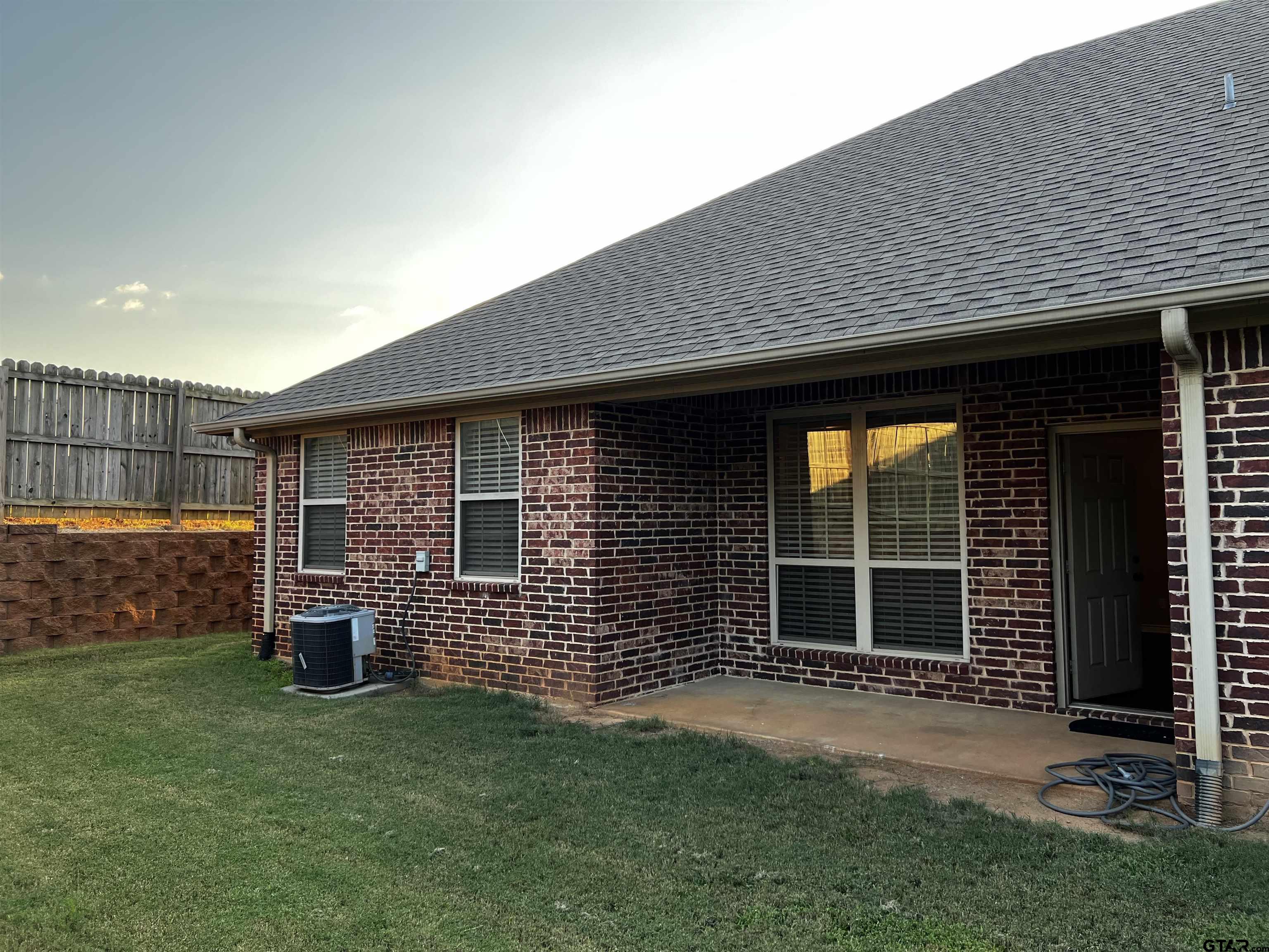 112 Letha Court Tyler, TX 75702 - Photo 33 of 45 a front view of a house with a garden