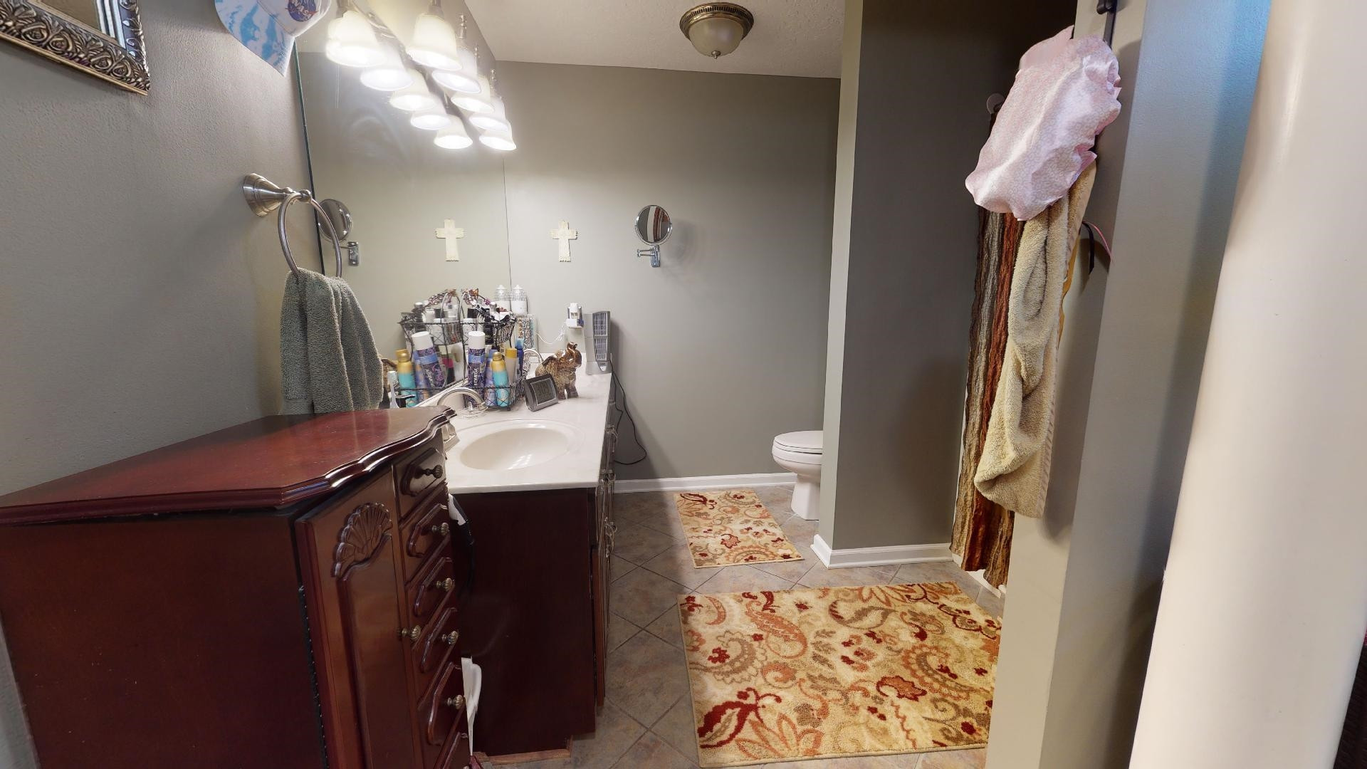 50 Bobby Thompson Road Newbern, TN 38059 - Photo 13 of 26 a bathroom with a sink mirror and vanity