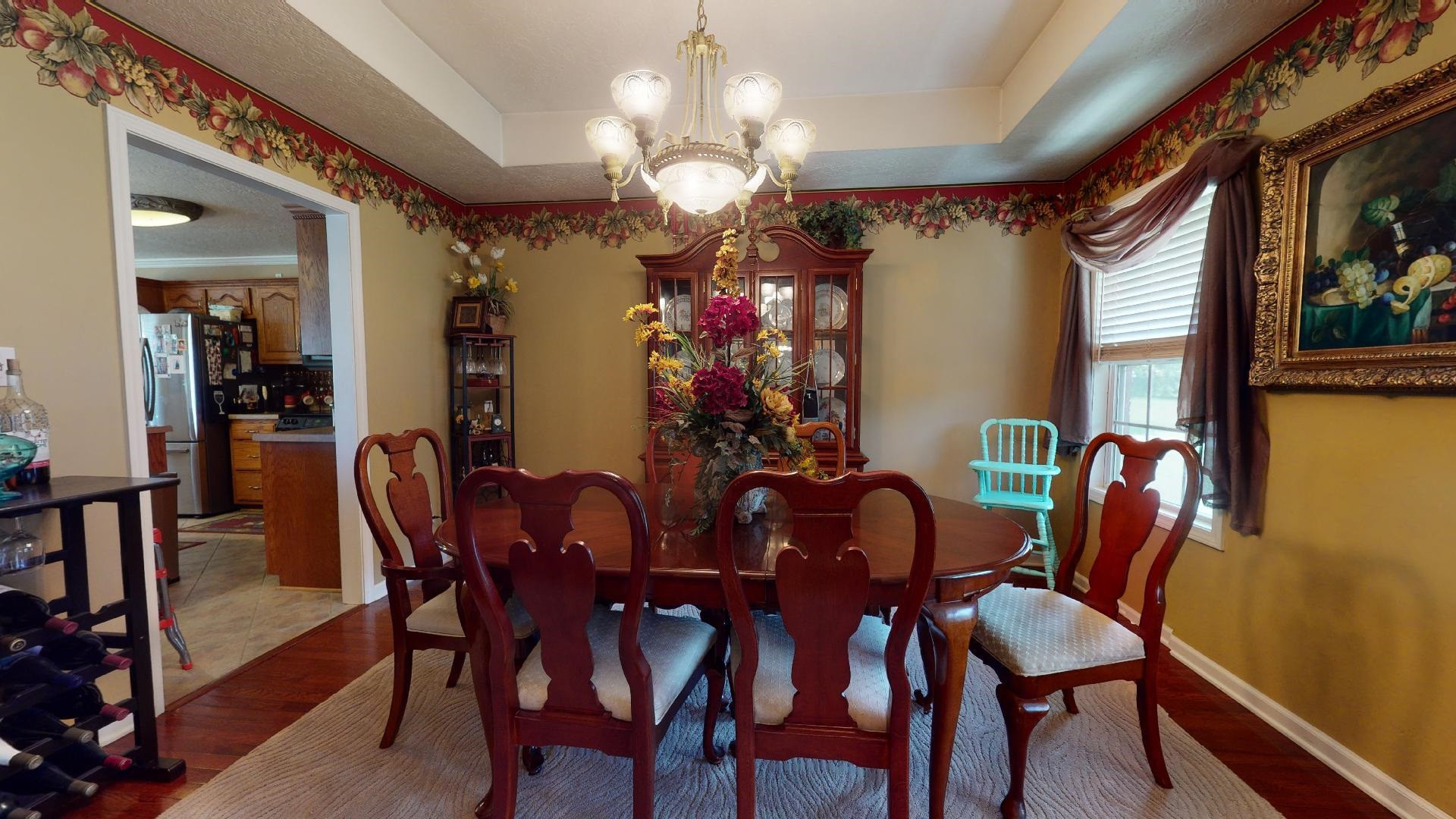 50 Bobby Thompson Road Newbern, TN 38059 - Photo 7 of 26 a view of a dining room with furniture and chandelier