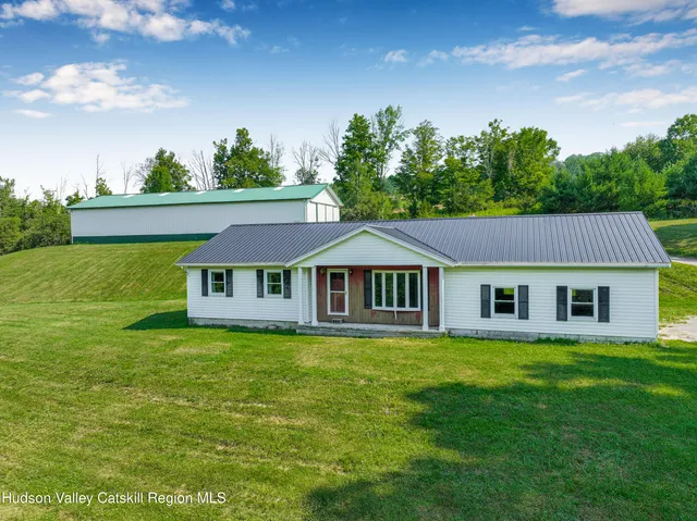 a house view with a garden space