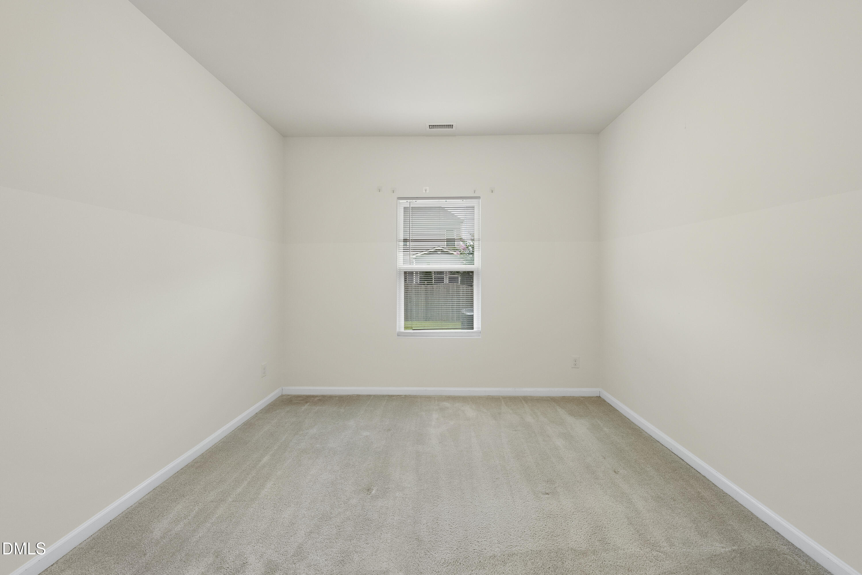 905 Lippincott Road Durham, NC 27703 - Photo 12 of 24 an empty room with a window