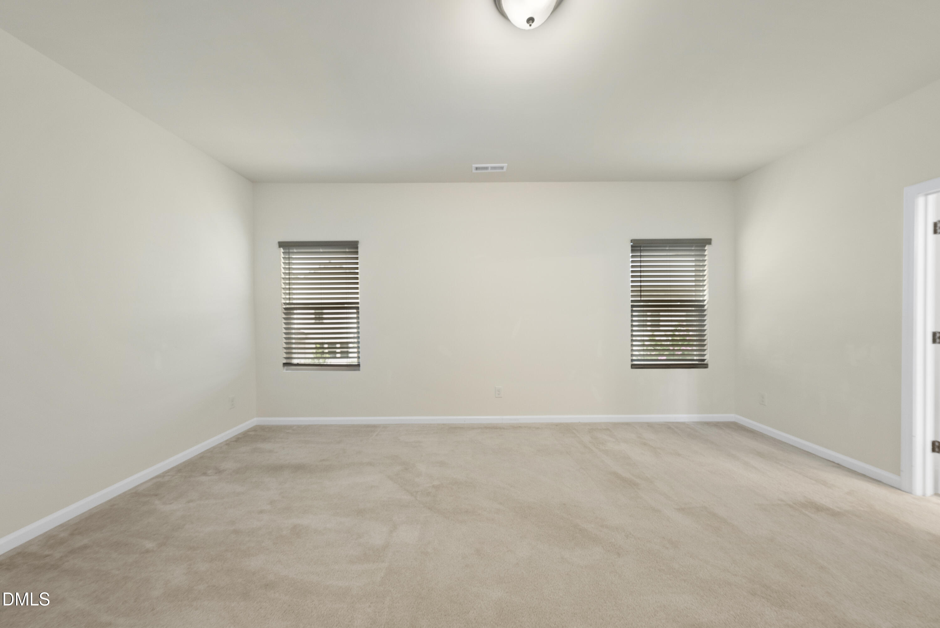 905 Lippincott Road Durham, NC 27703 - Photo 14 of 24 an empty room with windows