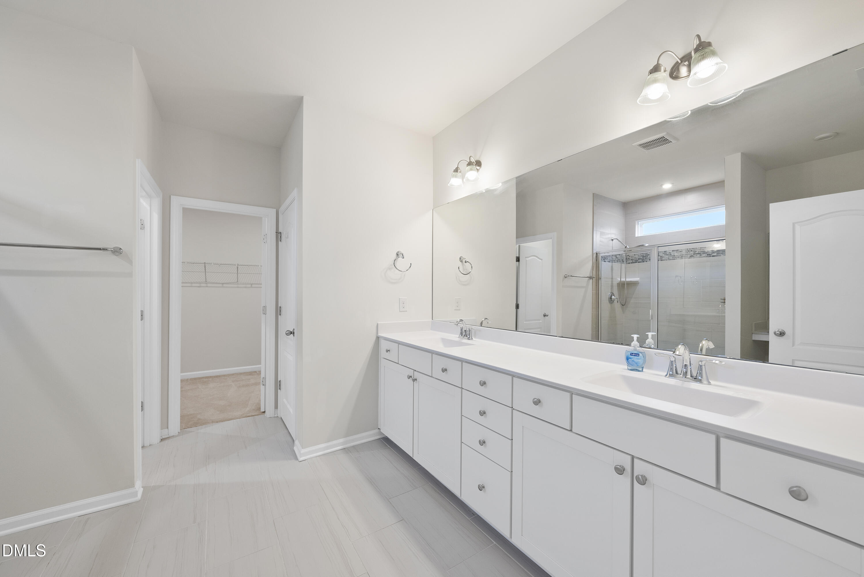 905 Lippincott Road Durham, NC 27703 - Photo 15 of 24 a bathroom with a double vanity sink mirror and double