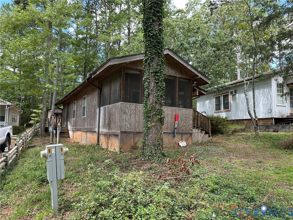 View of home's exterior with a sunroom