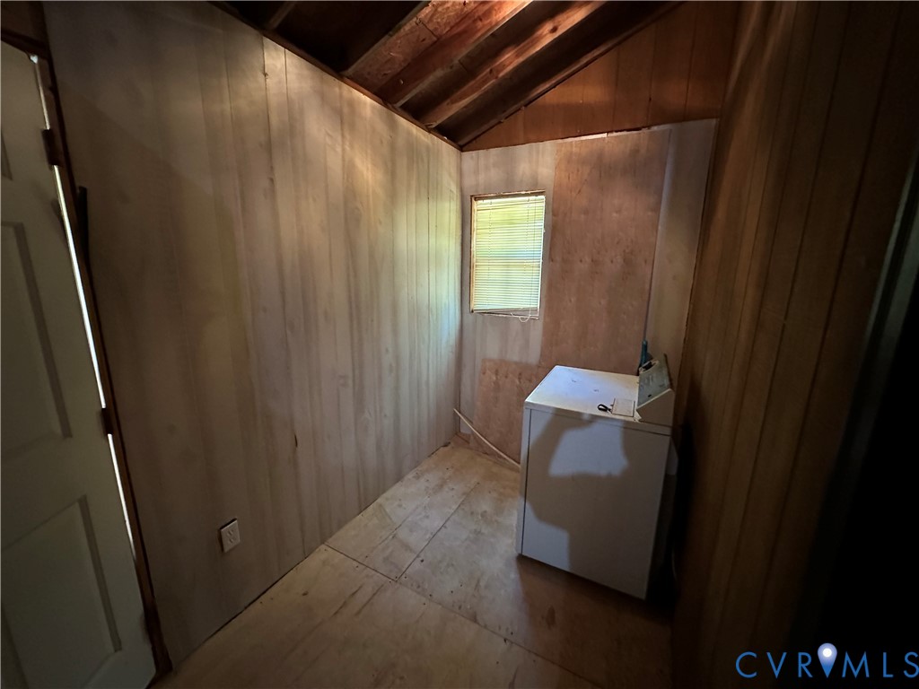 421 Happy Trail Bracey, VA 23919 - Photo 16 of 22 Laundry room with wooden walls and washer / dryer