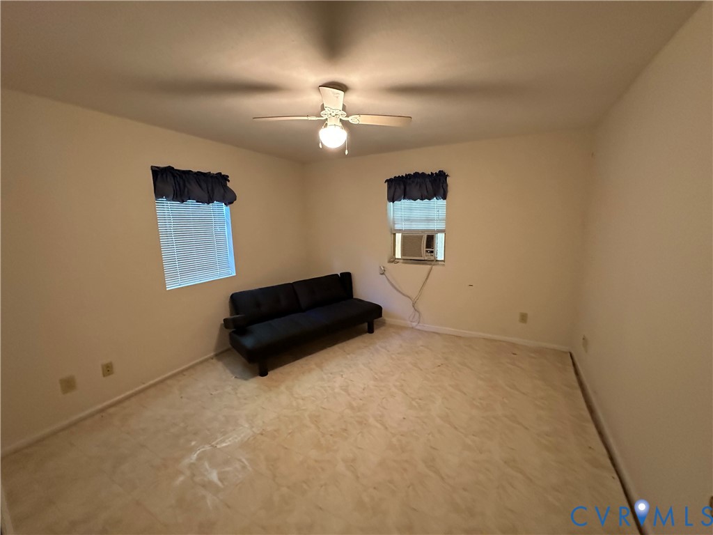421 Happy Trail Bracey, VA 23919 - Photo 17 of 22 Unfurnished room with a ceiling fan and cooling un