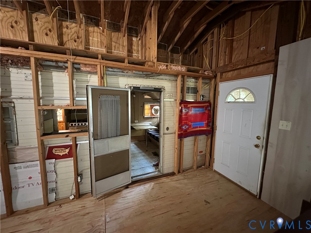 421 Happy Trail Bracey, VA 23919 - Photo 9 of 22 Foyer entrance with wooden walls