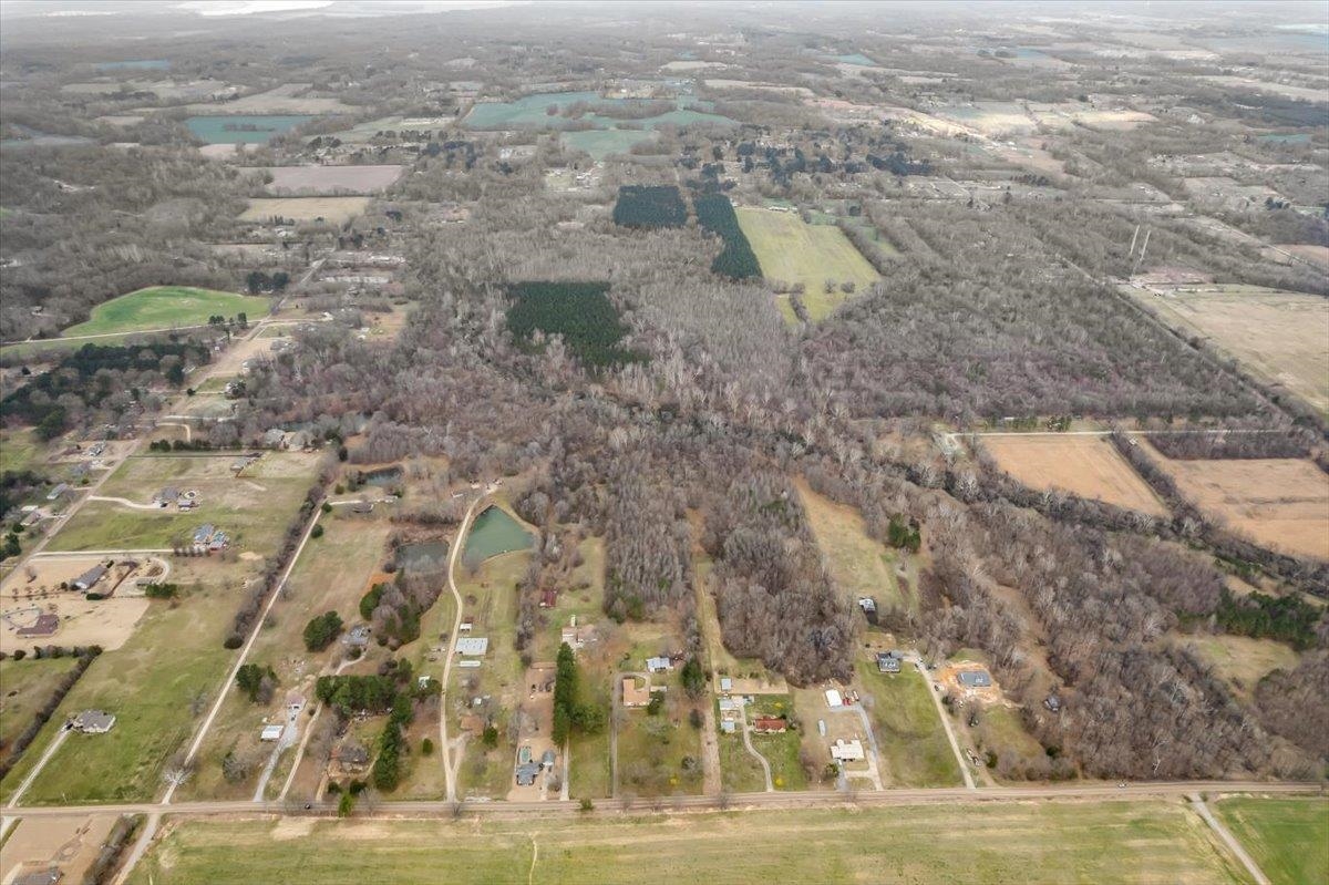 2972 Russell Bond Road Millington, TN 38053 - Photo 17 of 38 Aerial view of property and surrounding area with rural landscape, abundant farmland, and a large body of water