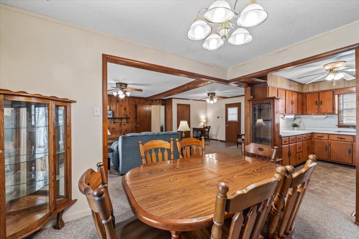 2972 Russell Bond Road Millington, TN 38053 - Photo 25 of 38 Dining space with a ceiling fan, a textured ceiling, light colored carpet, and suspended lighting