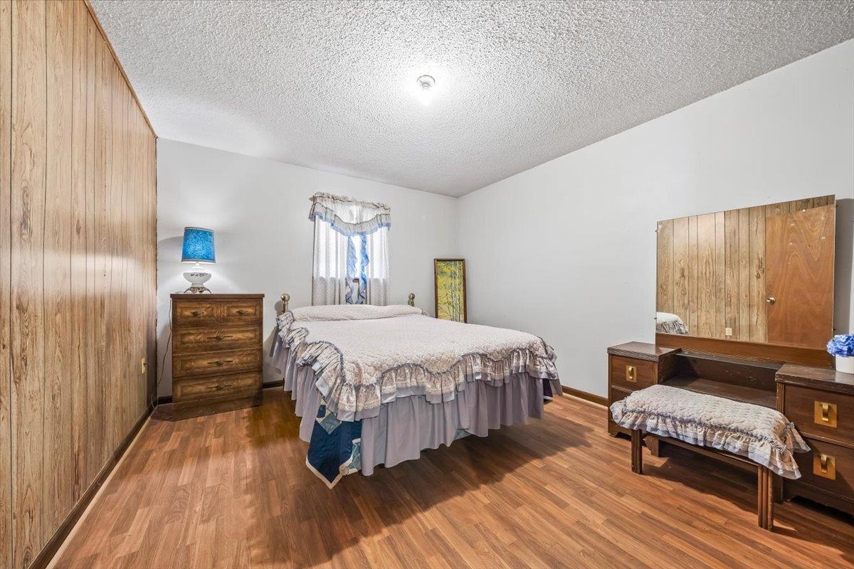 2972 Russell Bond Road Millington, TN 38053 - Photo 30 of 38 Bedroom with a textured ceiling and wood finished floors