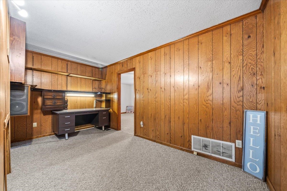 2972 Russell Bond Road Millington, TN 38053 - Photo 35 of 38 Office featuring carpet flooring, wooden walls, a textured ceiling, and crown molding