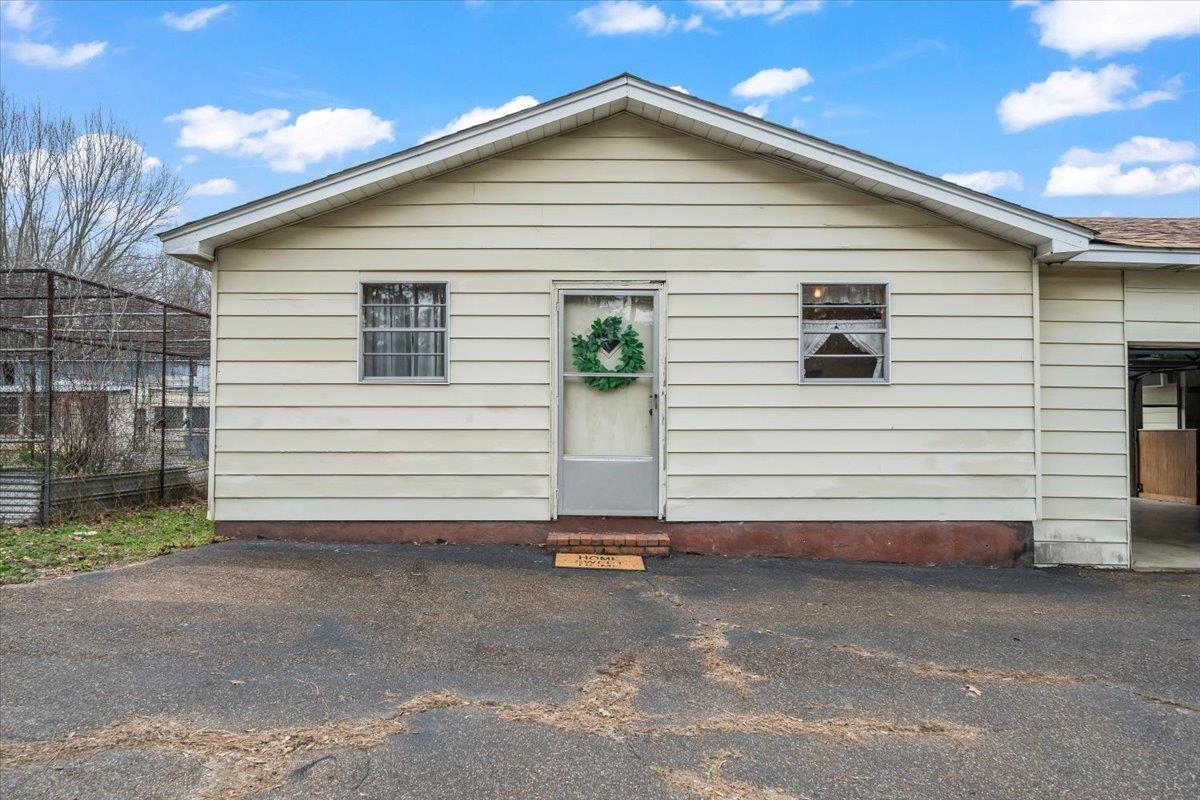 2972 Russell Bond Road Millington, TN 38053 - Photo 7 of 38 a view of a white house with a small yard