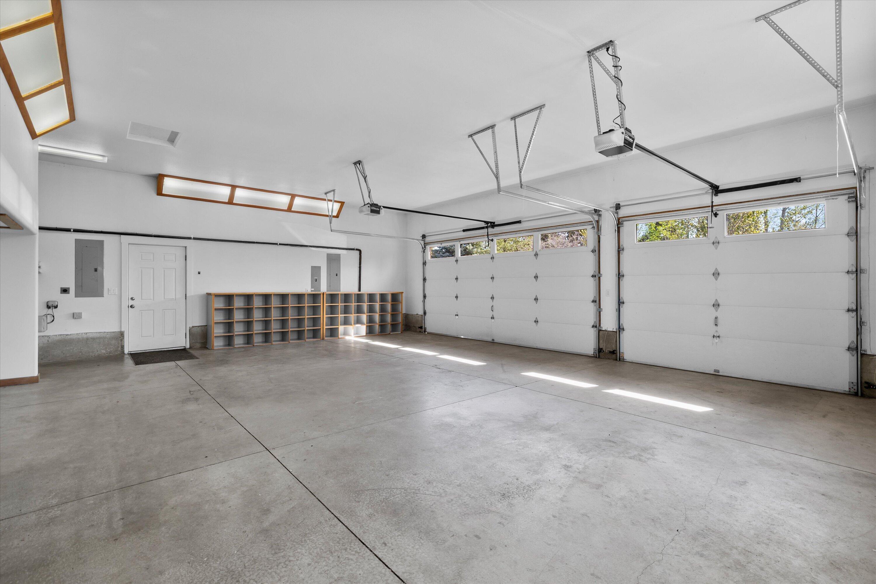 64155 Hunnell Road Bend, OR 97703 - Photo 54 of 96 3-car garage with extensive storage and bonus room for work or hobbies.
