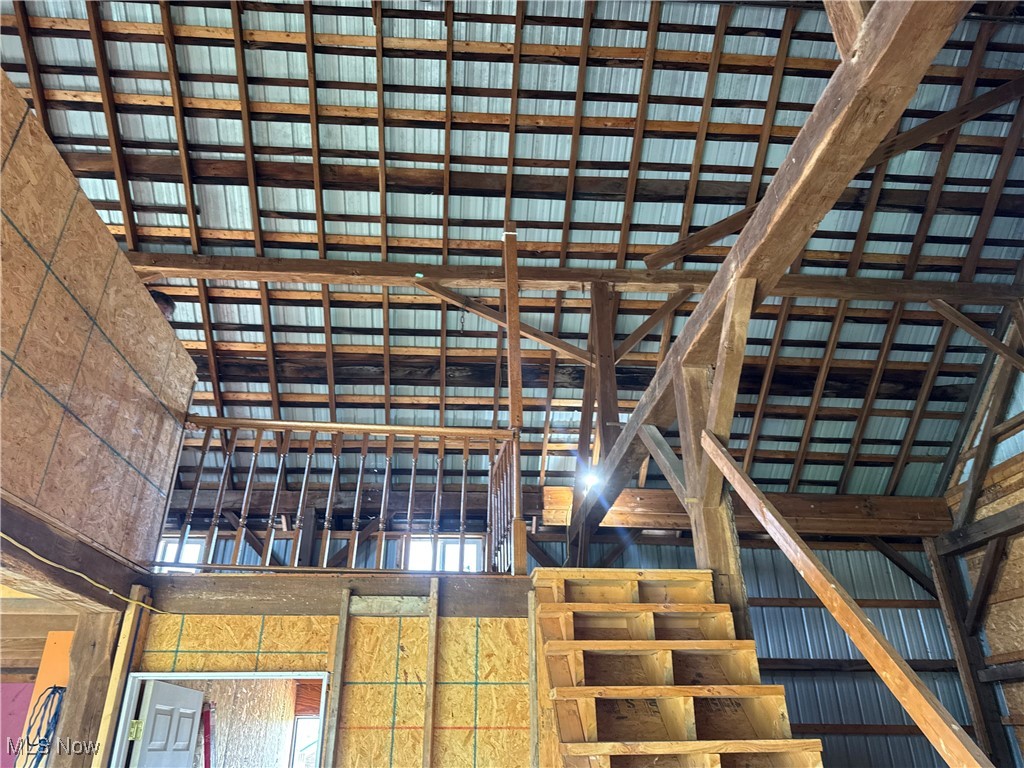 6255 Highland Ridge Road Lowell, OH 45744 - Photo 33 of 40 Stairs featuring a high ceiling