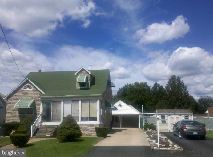 3926 North Point Road Dundalk, MD 21222 - Photo 23 of 23 a front view of a house with a garden