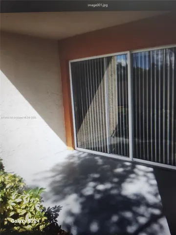 a white wall with a sign on it