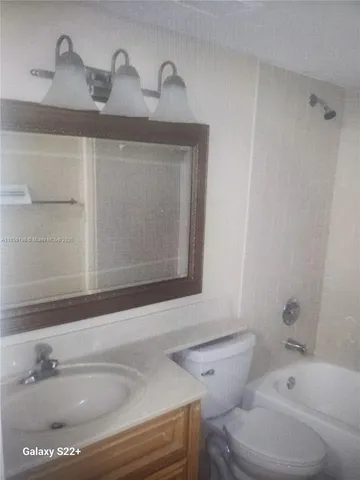 a bathroom with a sink and a toilet