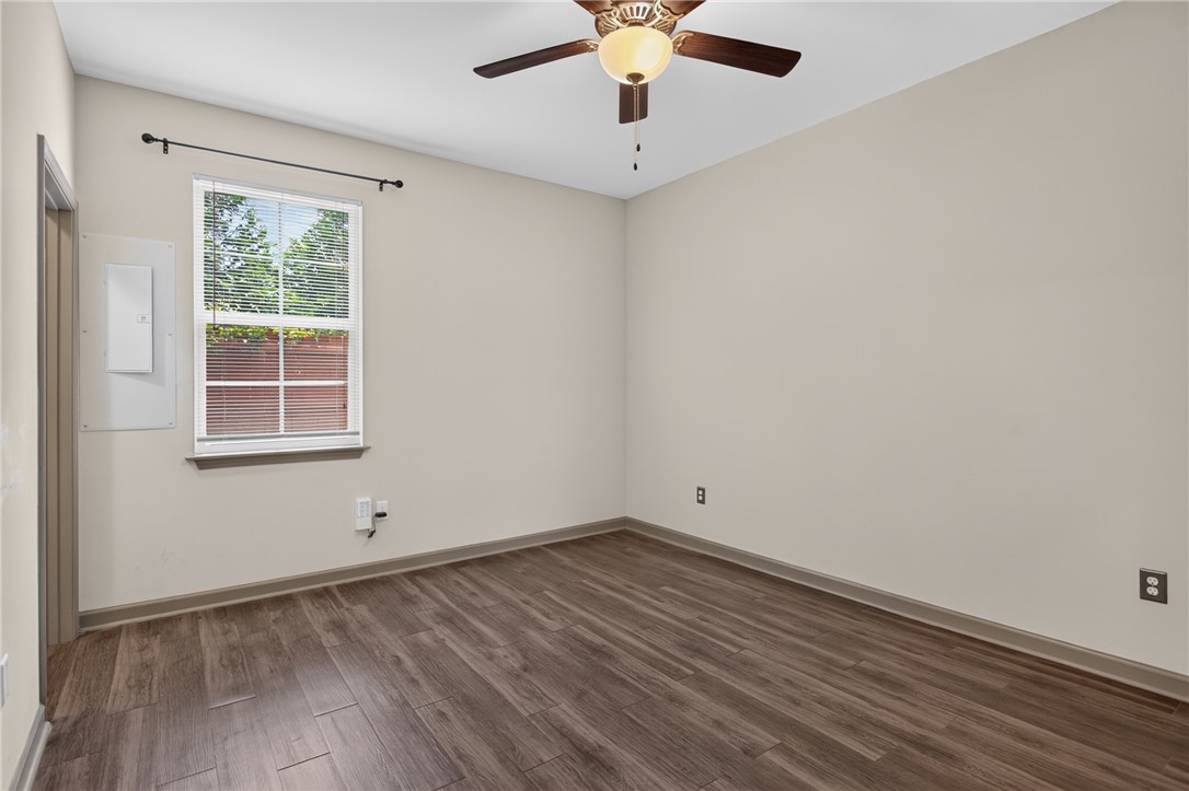 235 Pendleton Road, Unit K1 Clemson, SC 29631 - Photo 23 of 49 Laminate flooring and a ceiling fan create a comfortable living area.
