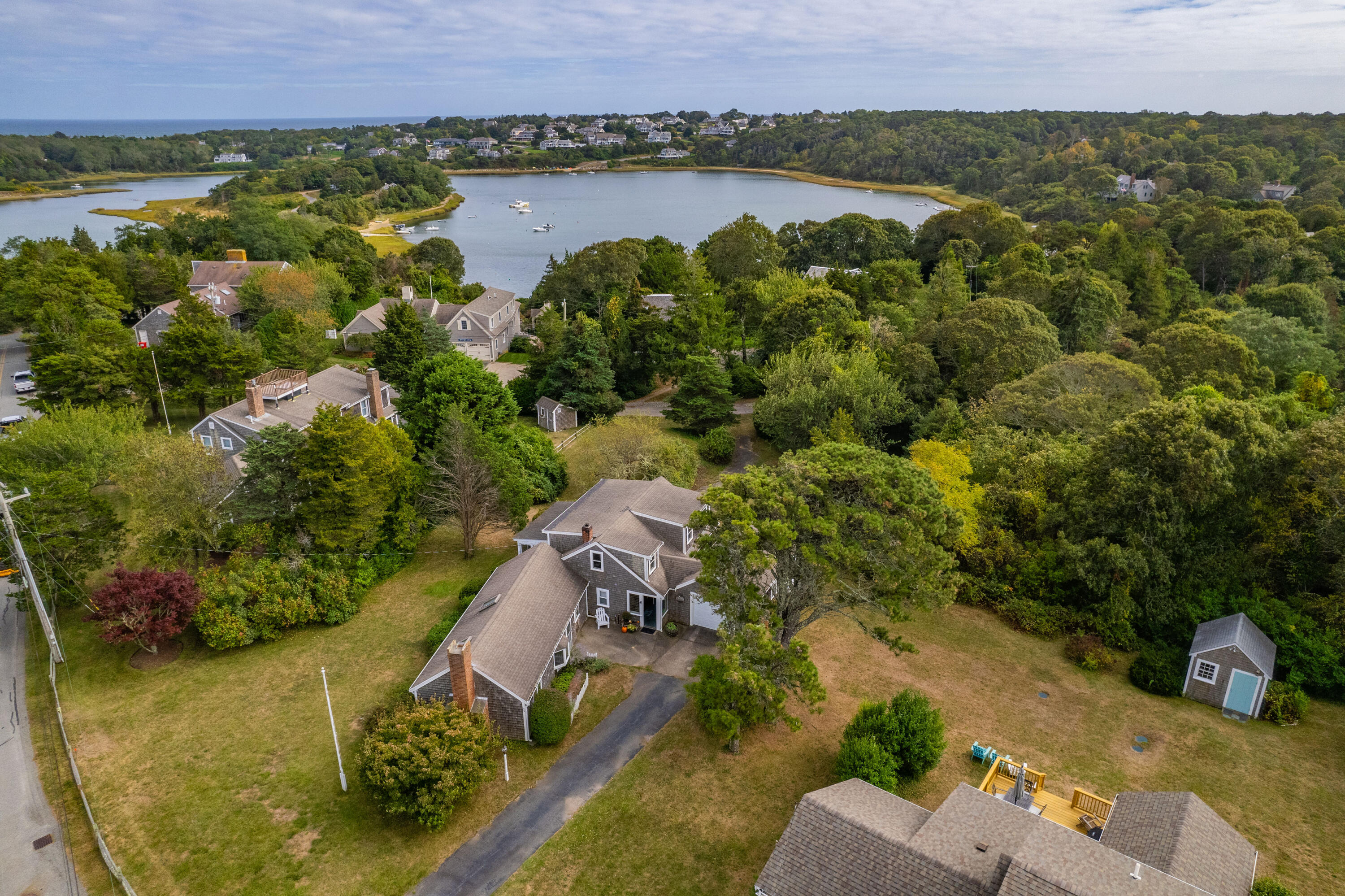 an aerial view of a house with a lake view