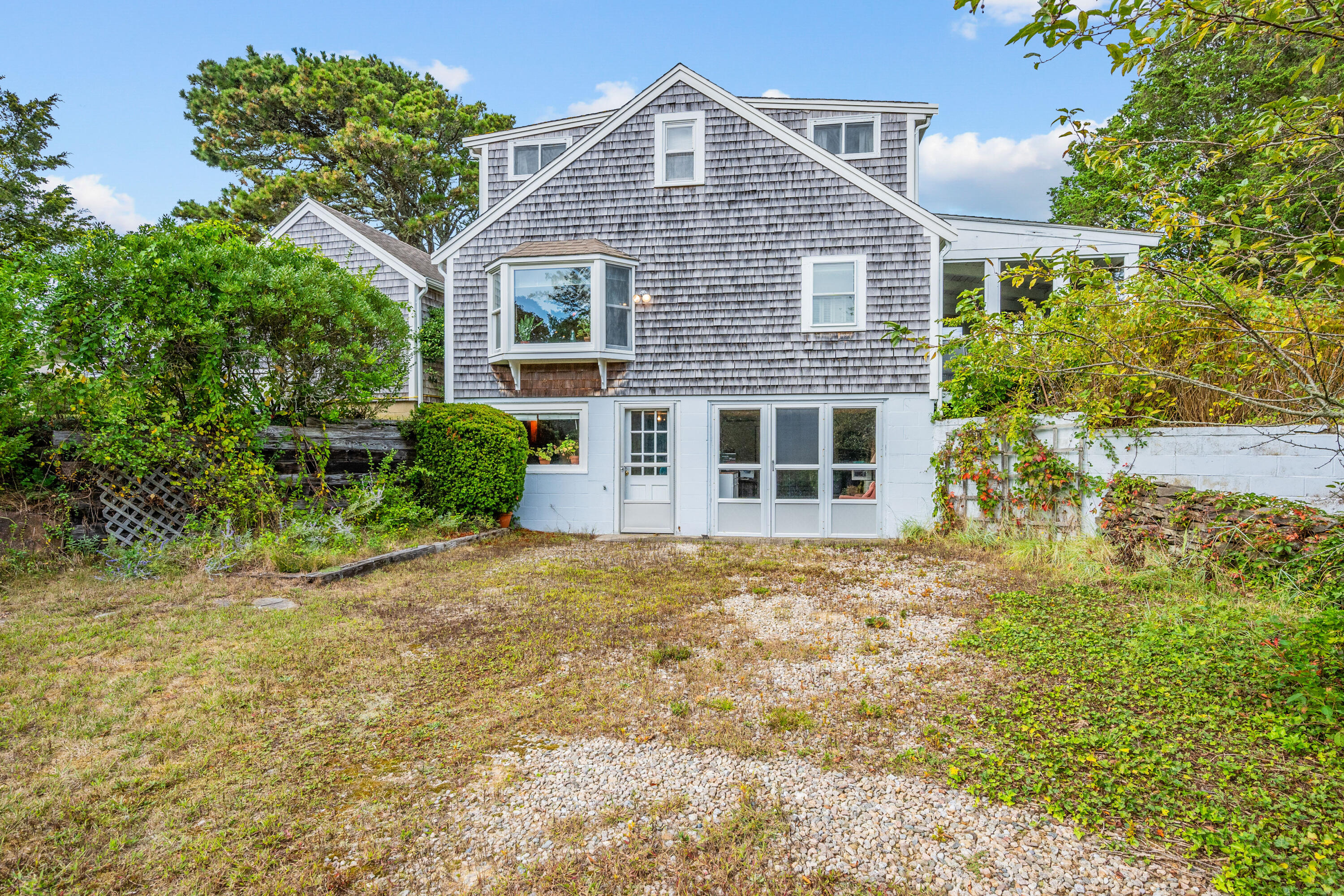 33 Mill Pond Road Orleans, MA 02653 - Photo 13 of 50 a front view of a house with garden