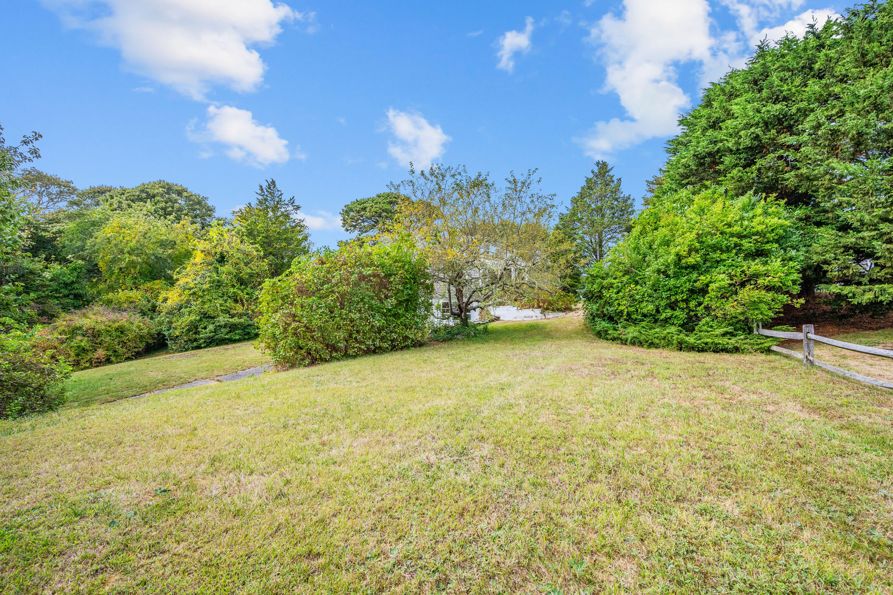 33 Mill Pond Road Orleans, MA 02653 - Photo 16 of 50 a view of a yard with an trees