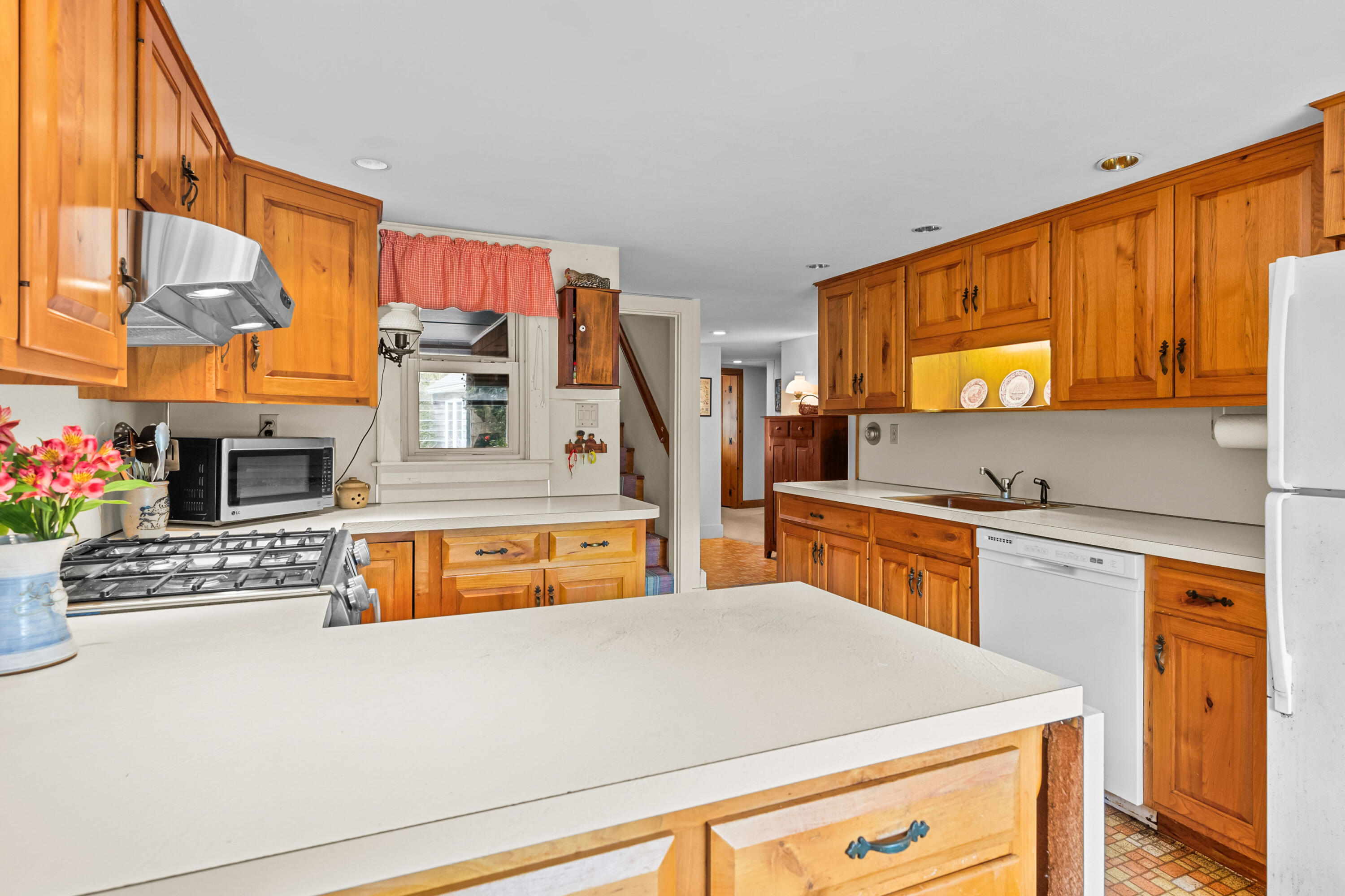 33 Mill Pond Road Orleans, MA 02653 - Photo 21 of 50 a view of kitchen with stainless steel appliances granite countertop a sink and cabinets