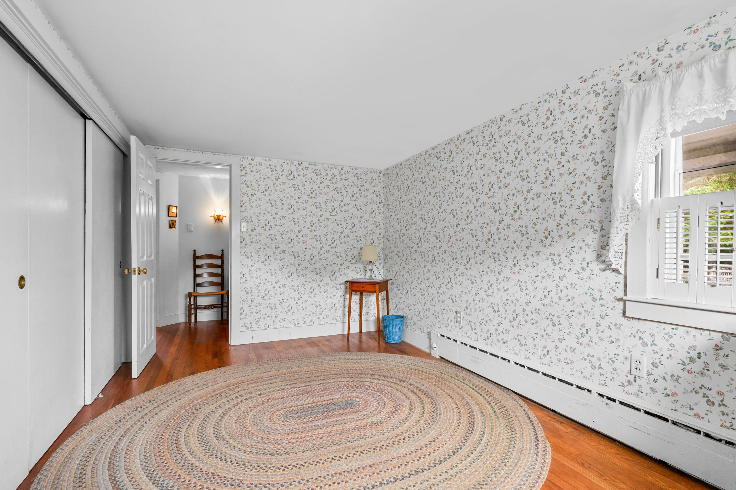 33 Mill Pond Road Orleans, MA 02653 - Photo 25 of 50 a bedroom with a bed and a dresser with rug