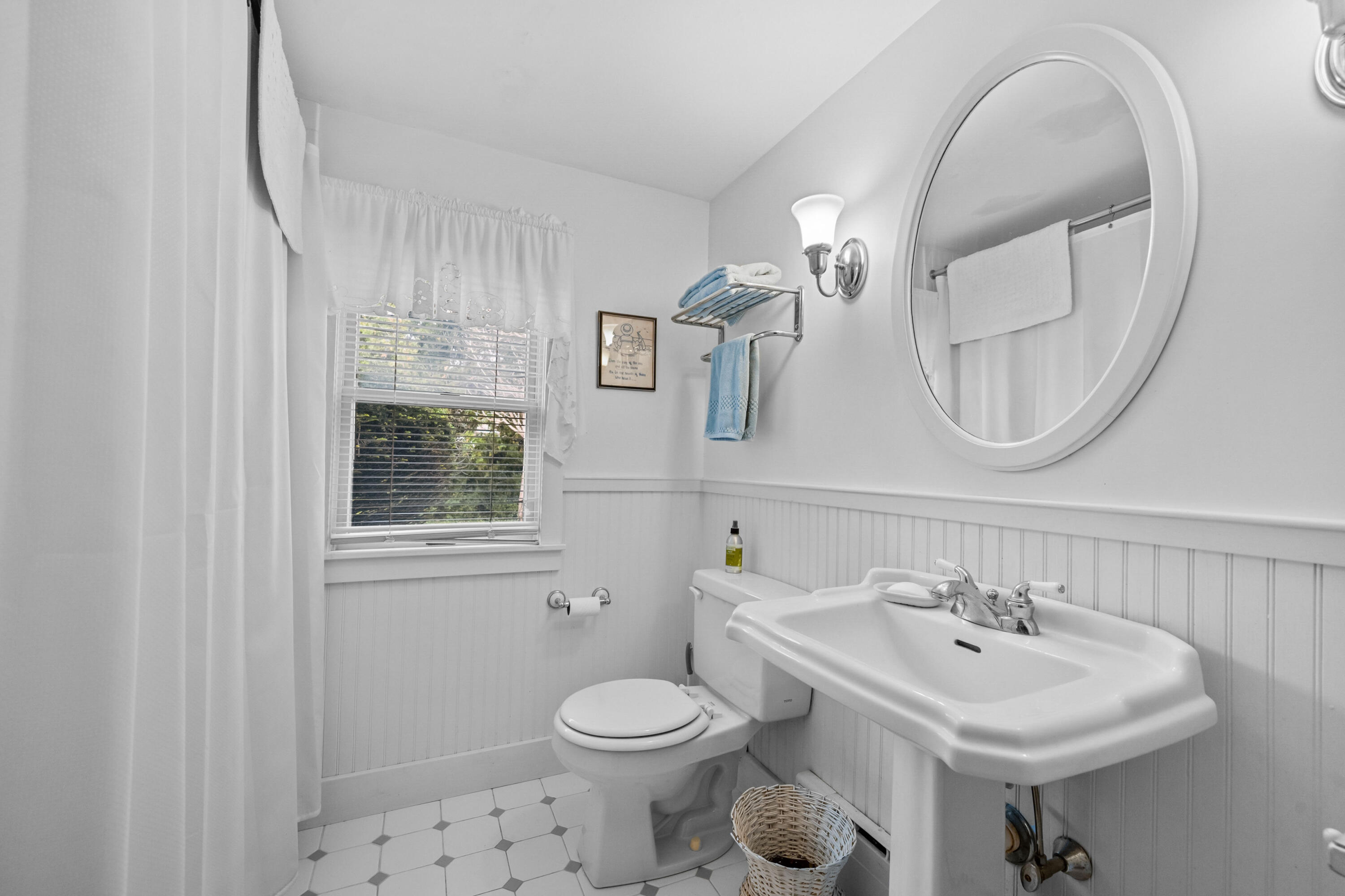 33 Mill Pond Road Orleans, MA 02653 - Photo 26 of 50 a bathroom with a sink a toilet and a mirror