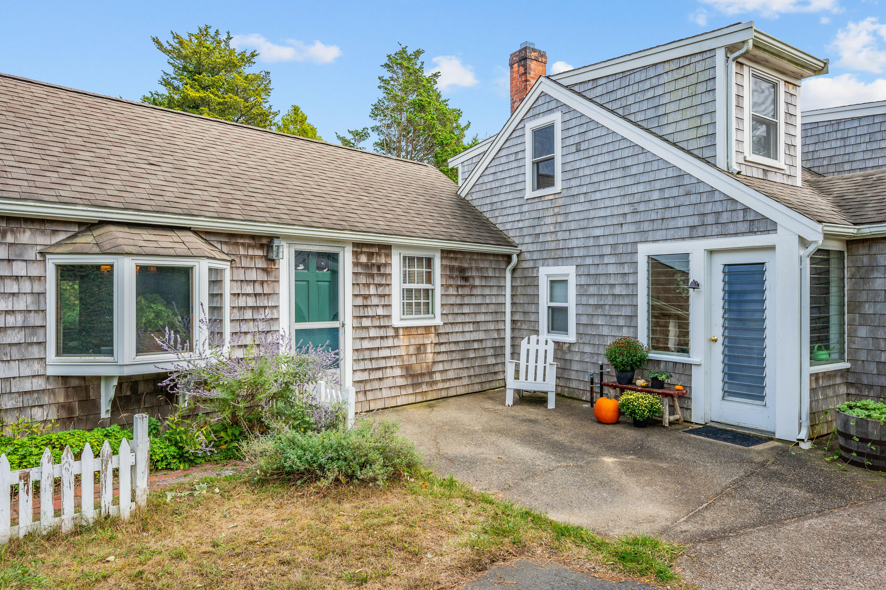 33 Mill Pond Road Orleans, MA 02653 - Photo 3 of 50 a front view of house with outdoor seating