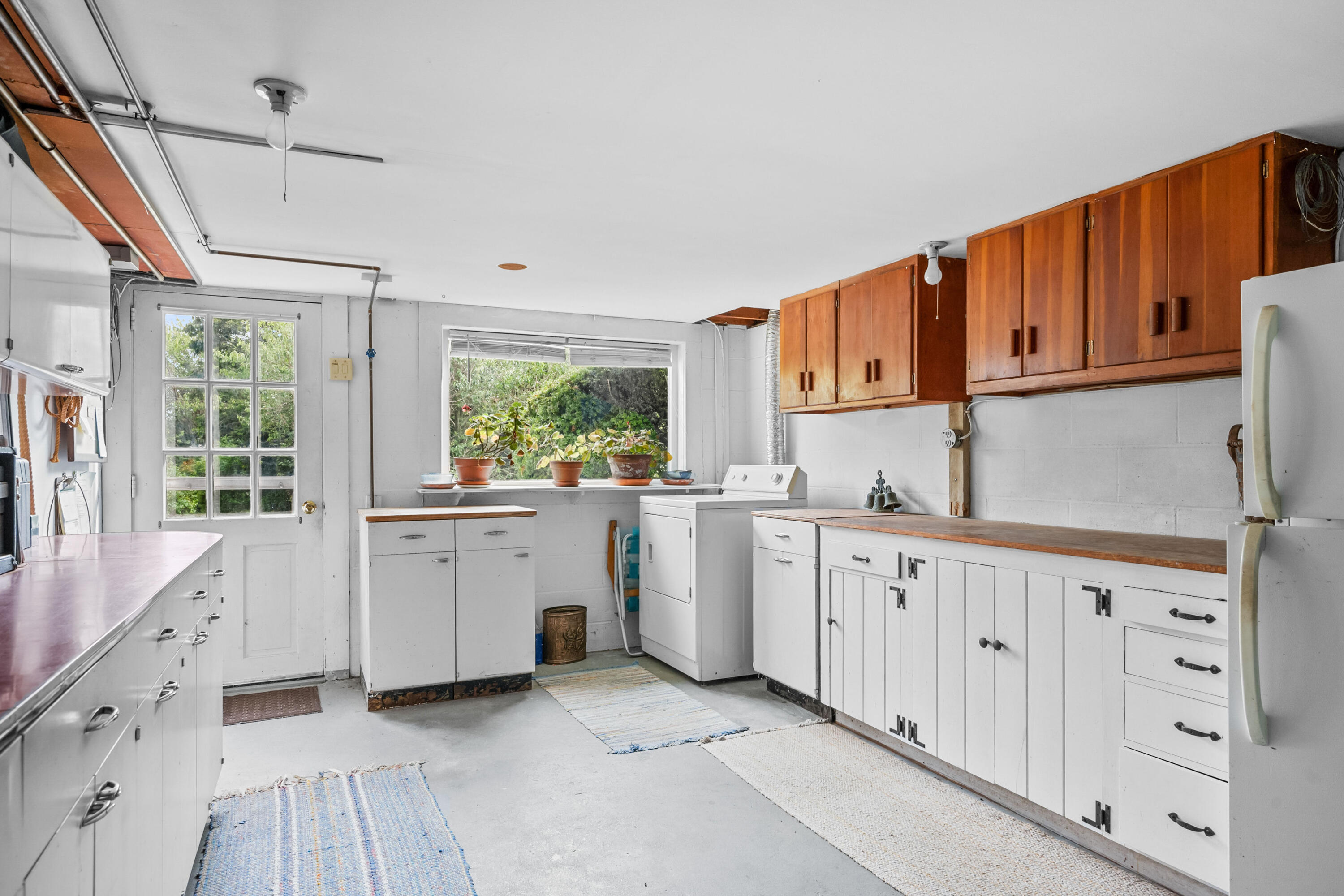 33 Mill Pond Road Orleans, MA 02653 - Photo 41 of 50 a kitchen with white cabinets and window