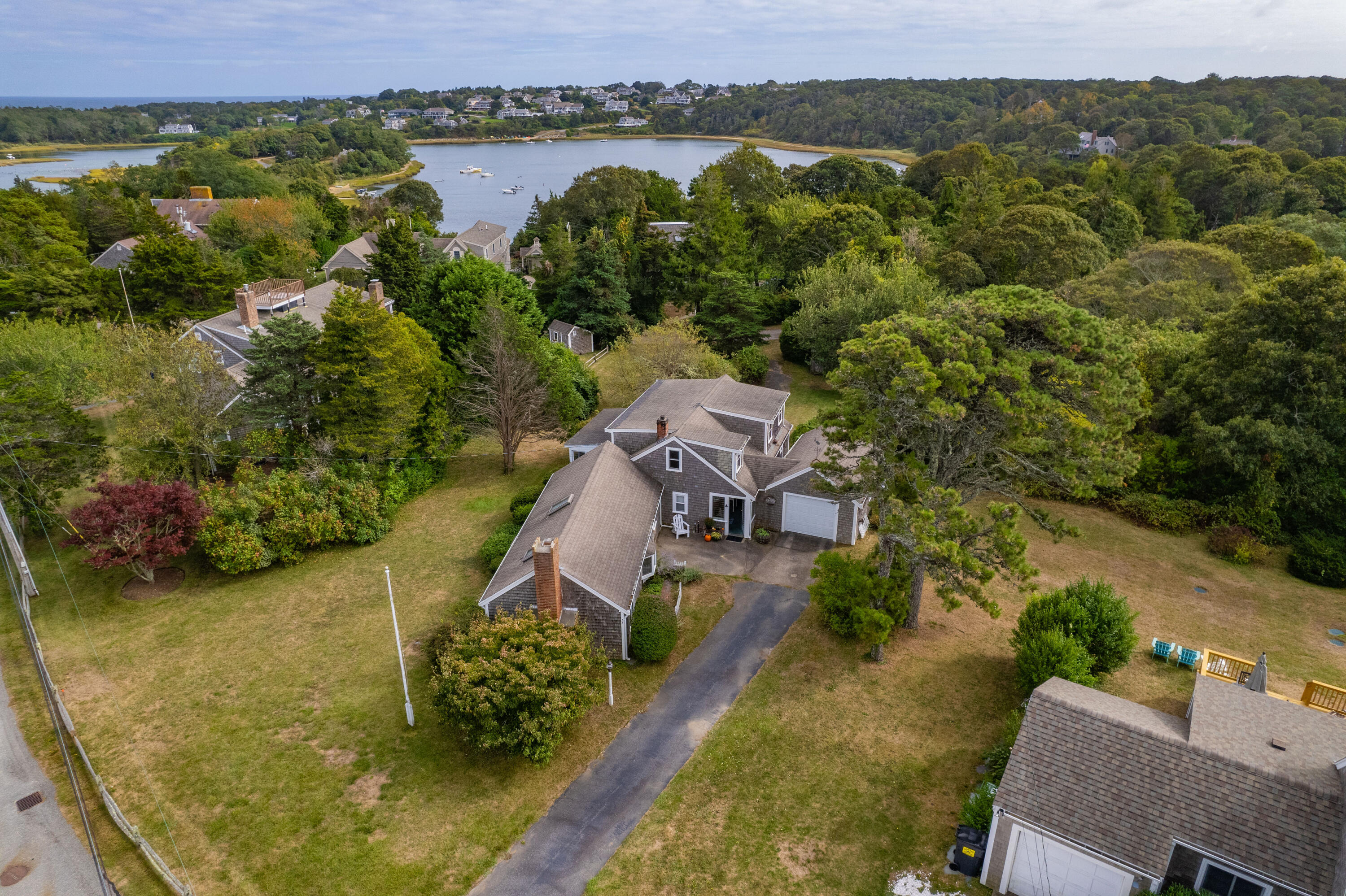 33 Mill Pond Road Orleans, MA 02653 - Photo 42 of 50 an aerial view of a house with a lake view