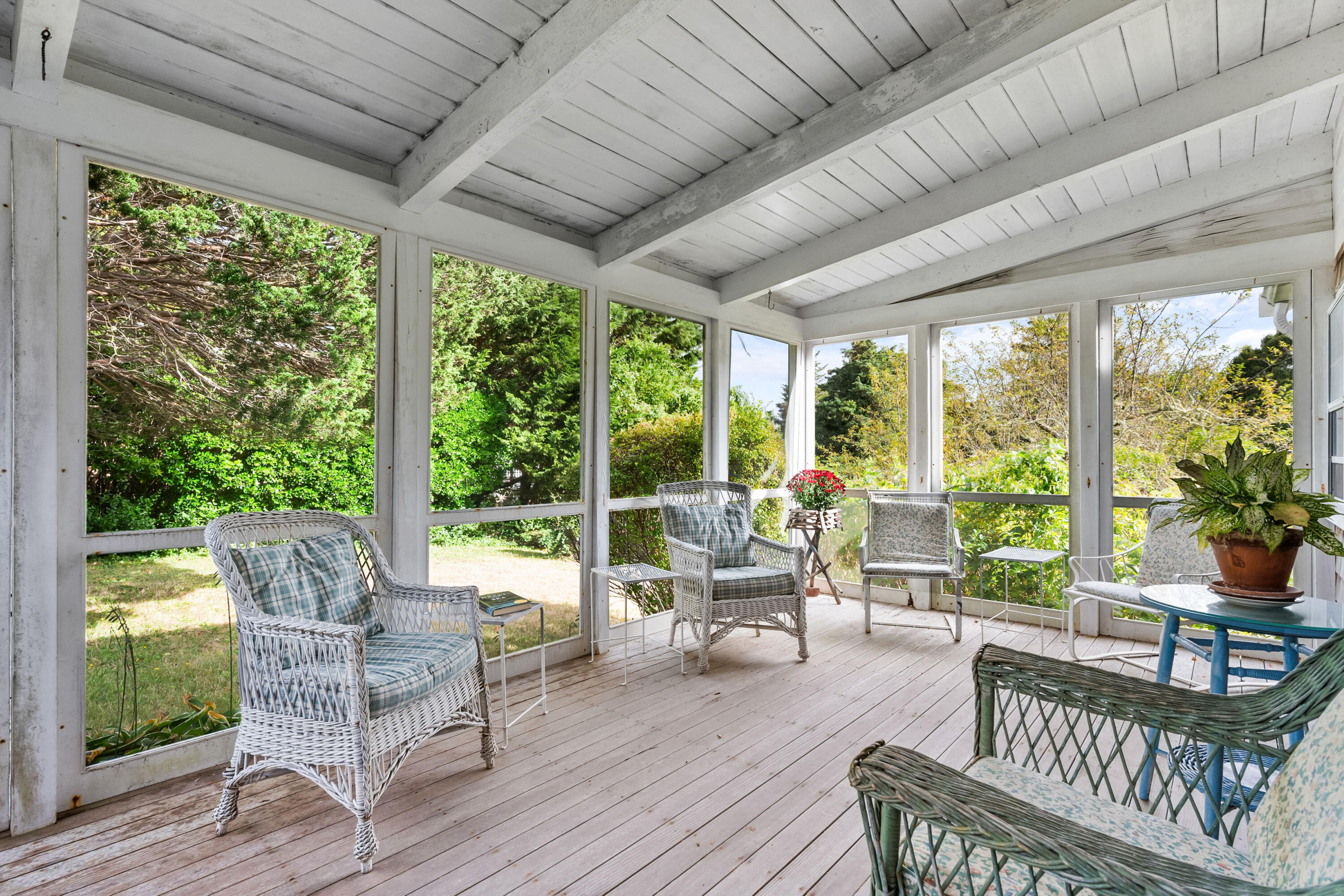 33 Mill Pond Road Orleans, MA 02653 - Photo 6 of 50 a living room with patio furniture and garden view