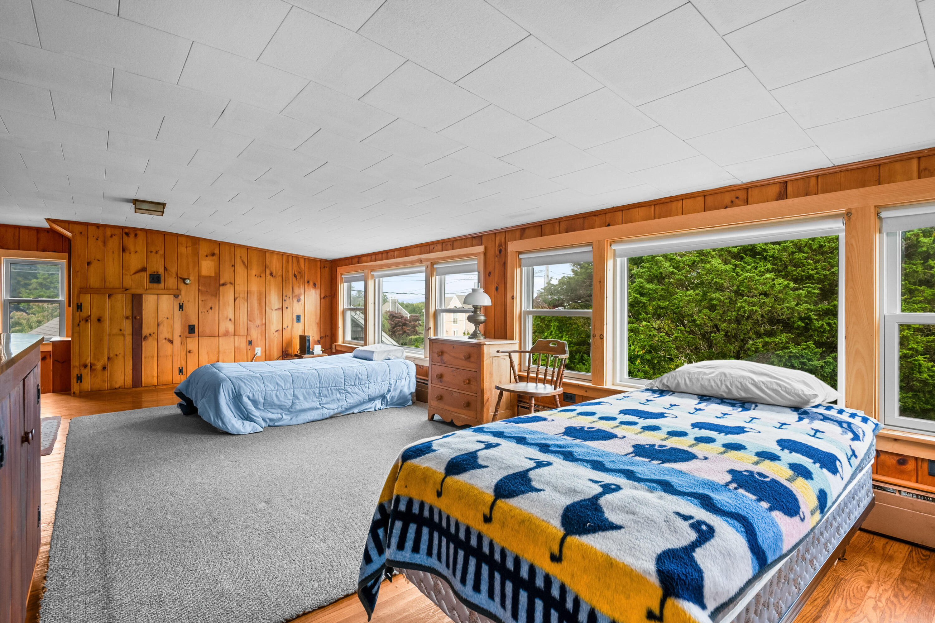 33 Mill Pond Road Orleans, MA 02653 - Photo 7 of 50 a bedroom with two beds and large window