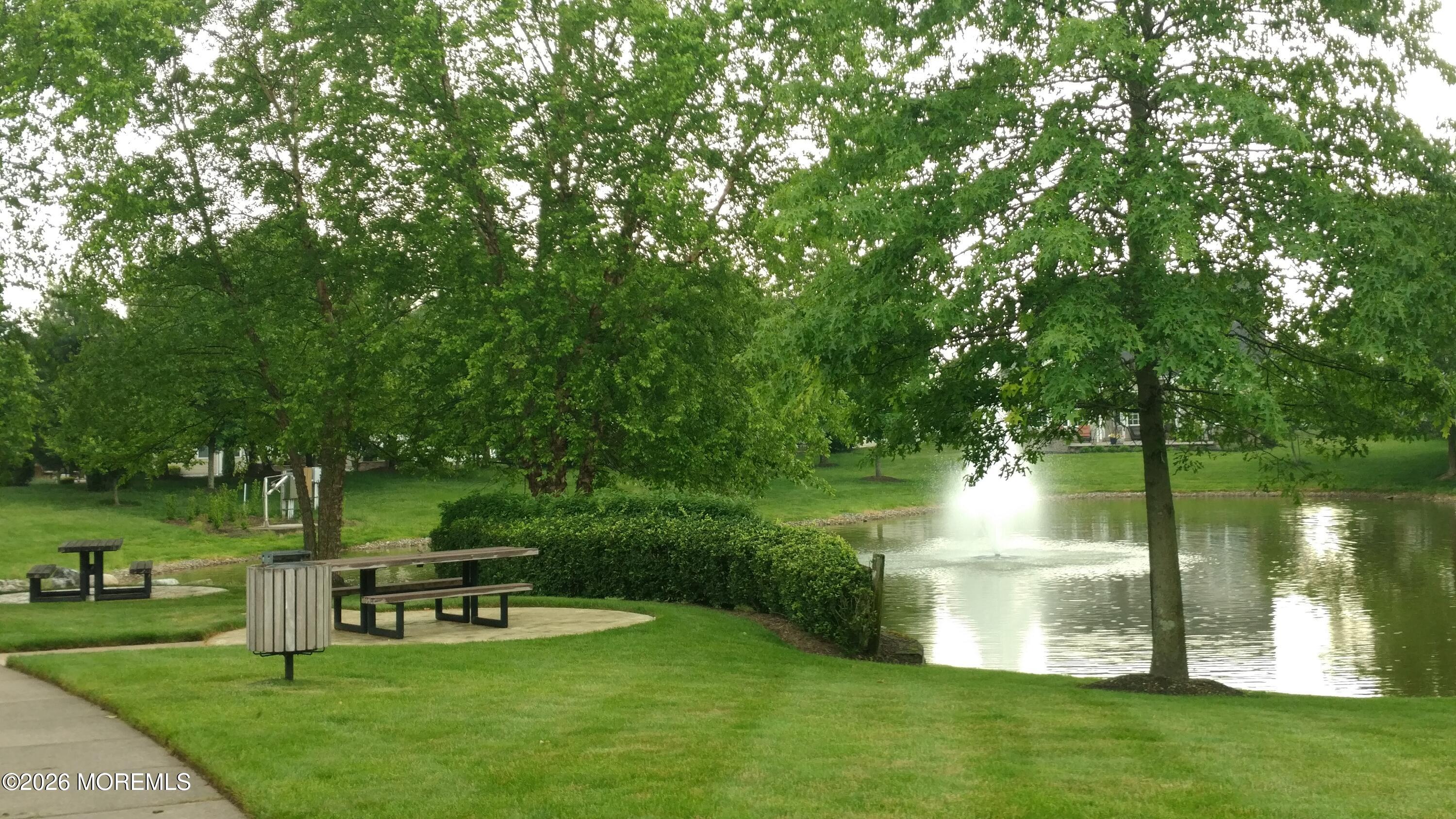 7 Brattleboro Road Jackson, NJ 08527 - Photo 49 of 62 a view of a lake with a garden and trees