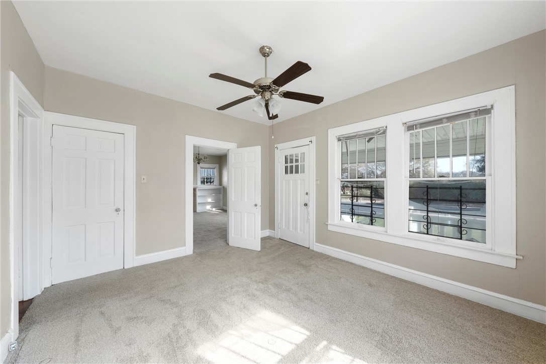 2012 North 5th Street Waco, TX 76708 - Photo 13 of 29 a view of a livingroom with a window and a ceiling fan