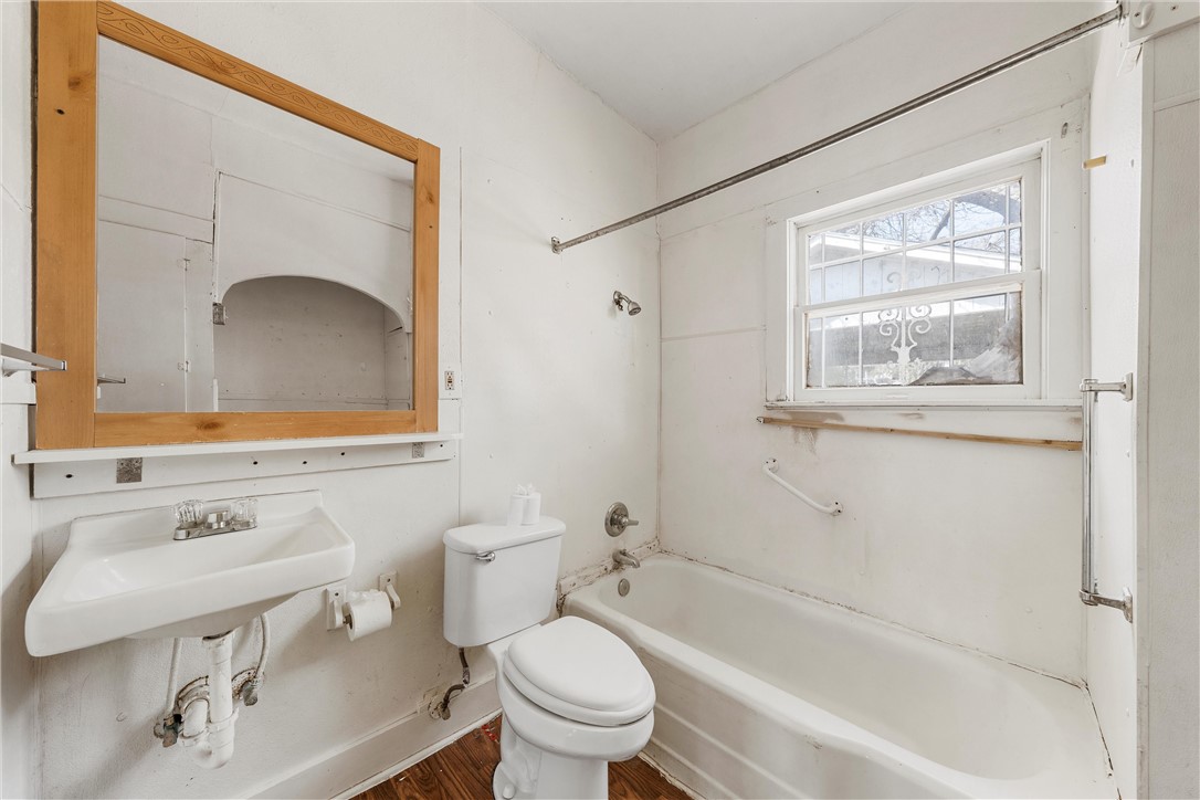 2012 North 5th Street Waco, TX 76708 - Photo 19 of 29 a bathroom with a sink toilet and shower