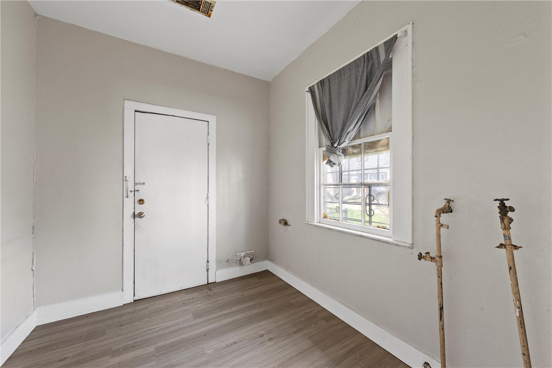 2012 North 5th Street Waco, TX 76708 - Photo 22 of 29 a view of an empty room with wooden floor and a window