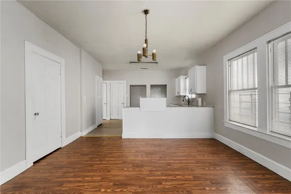 a view of a kitchen with a sink cabinet and a window