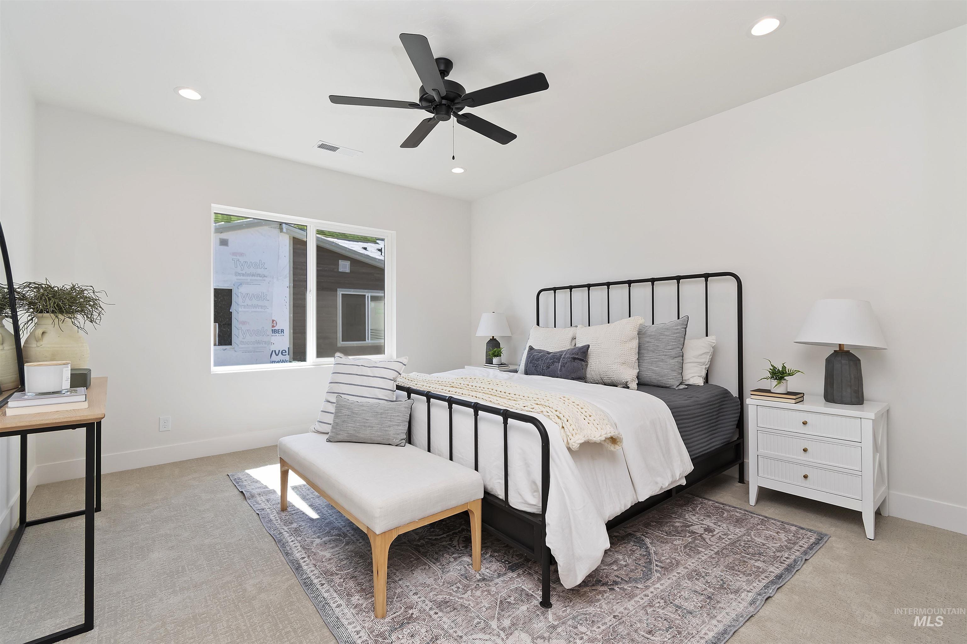 724 South Calhoun Lane Star, ID 83669 - Photo 24 of 46 Bedroom with light colored carpet, recessed lighting, and a ceiling fan