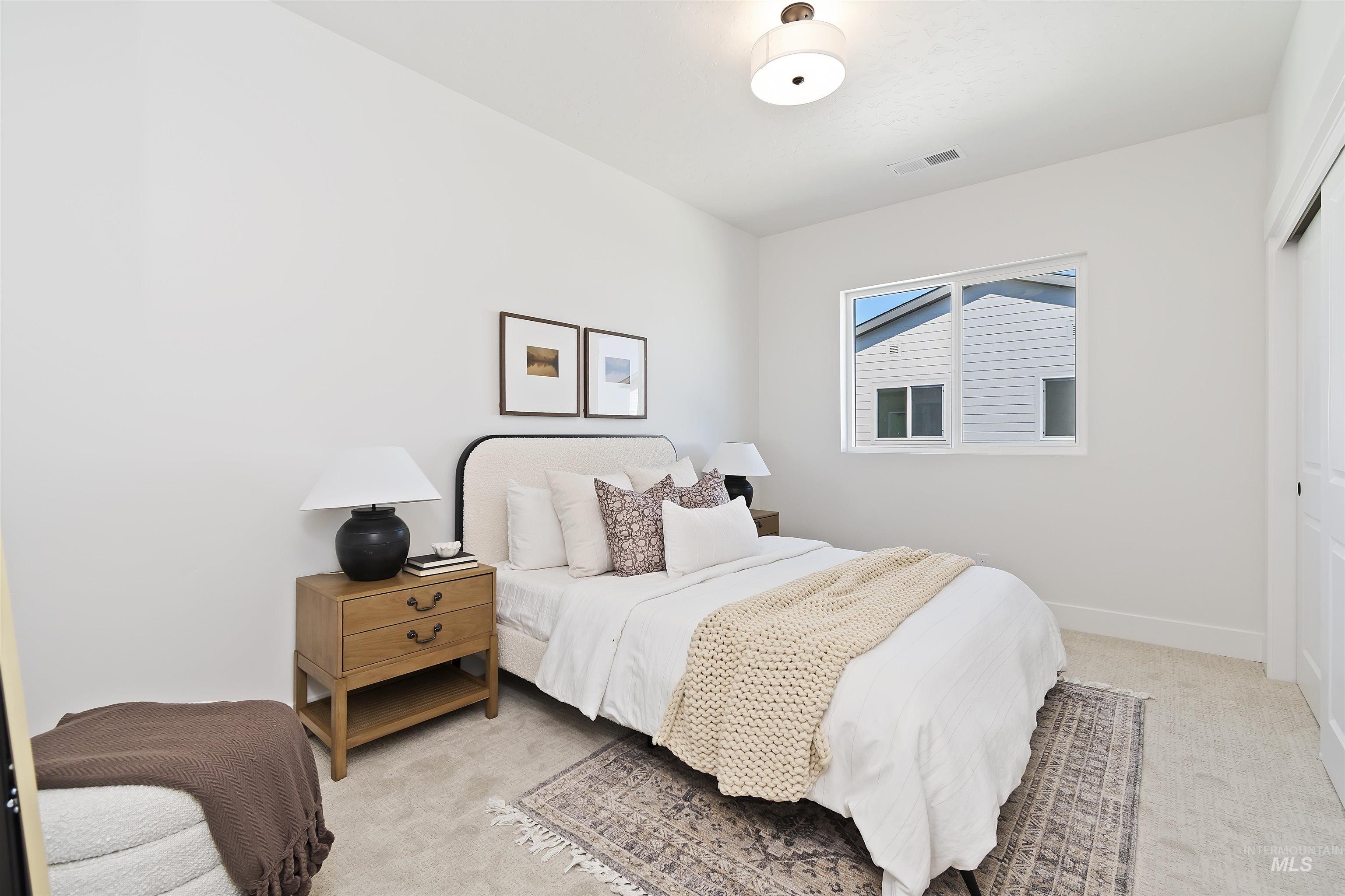 724 South Calhoun Lane Star, ID 83669 - Photo 29 of 46 Bedroom featuring light carpet and a closet