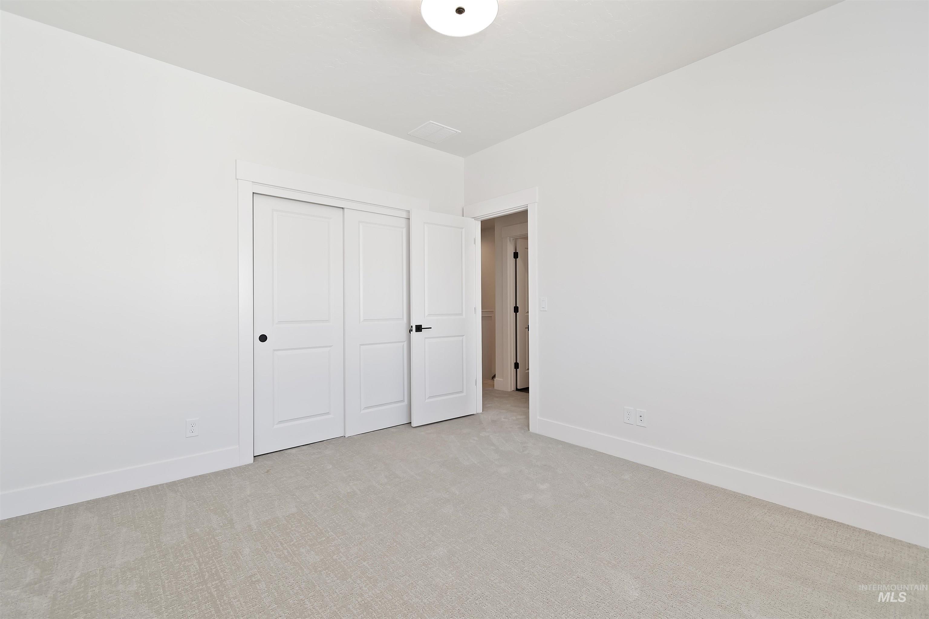 724 South Calhoun Lane Star, ID 83669 - Photo 33 of 46 Unfurnished bedroom with carpet flooring and a closet