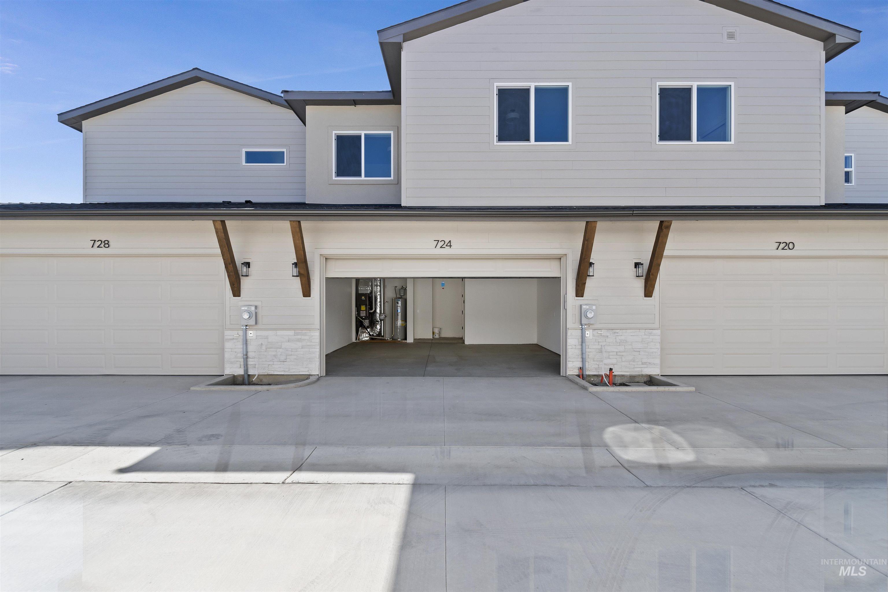 724 South Calhoun Lane Star, ID 83669 - Photo 35 of 46 View of back of property featuring driveway and water heater