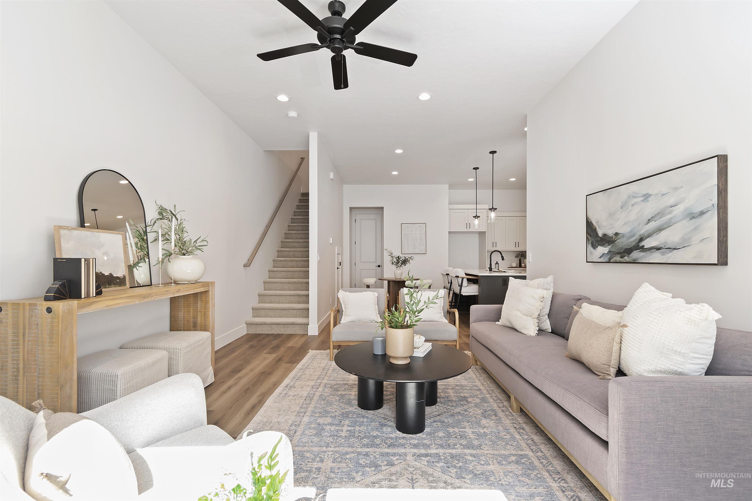 724 South Calhoun Lane Star, ID 83669 - Photo 4 of 44 Living area with stairs, wood finished floors, recessed lighting, and ceiling fan
