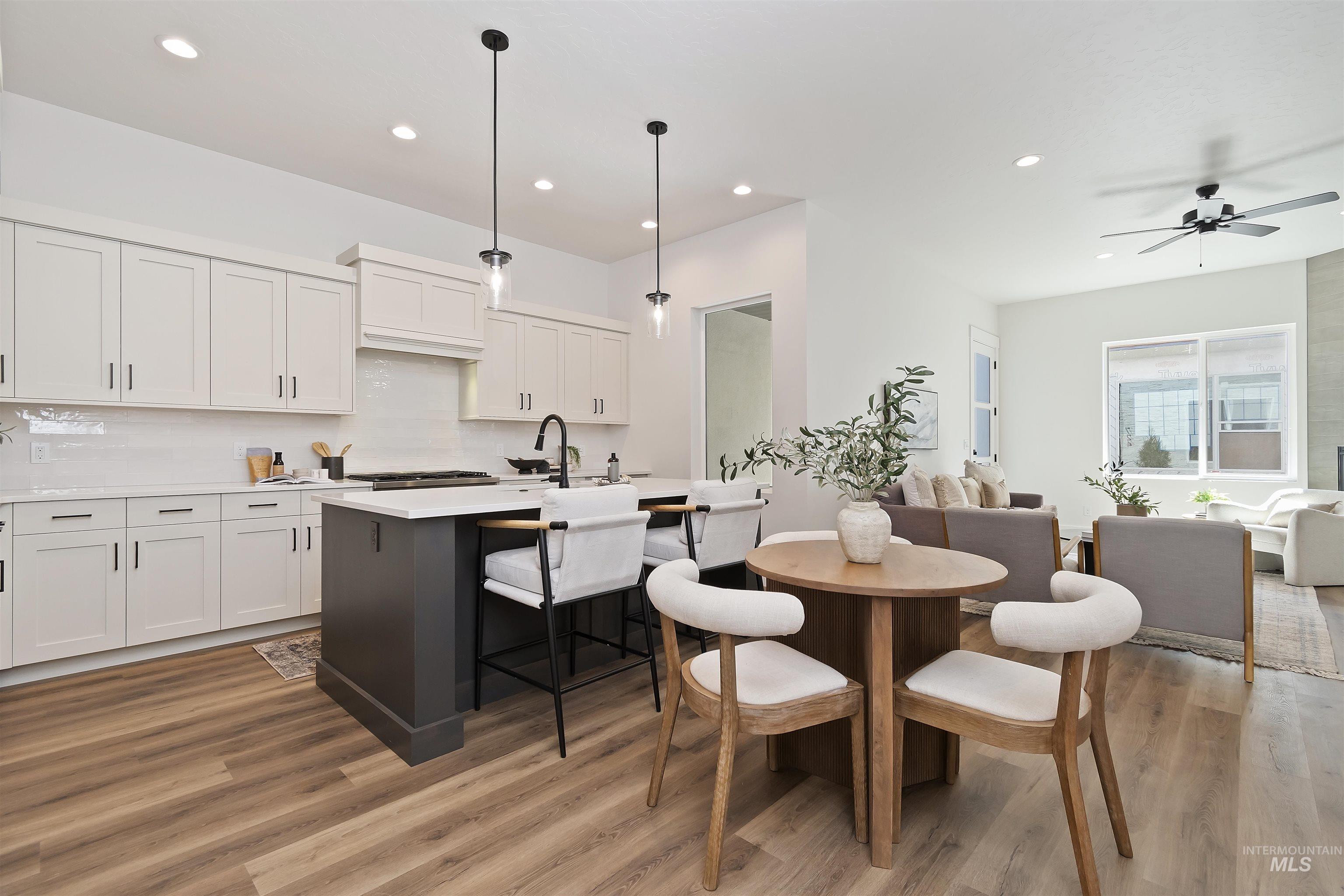 724 South Calhoun Lane Star, ID 83669 - Photo 10 of 44 Dining space featuring light wood-style floors, recessed lighting, and ceiling fan
