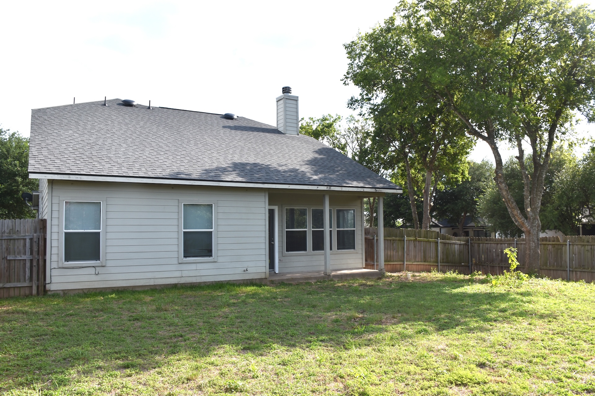 11300 Dimmit Street Manor, TX 78653 - Photo 23 of 23 A spacious backyard with a private fence, perfect for outdoor activities and relaxation.