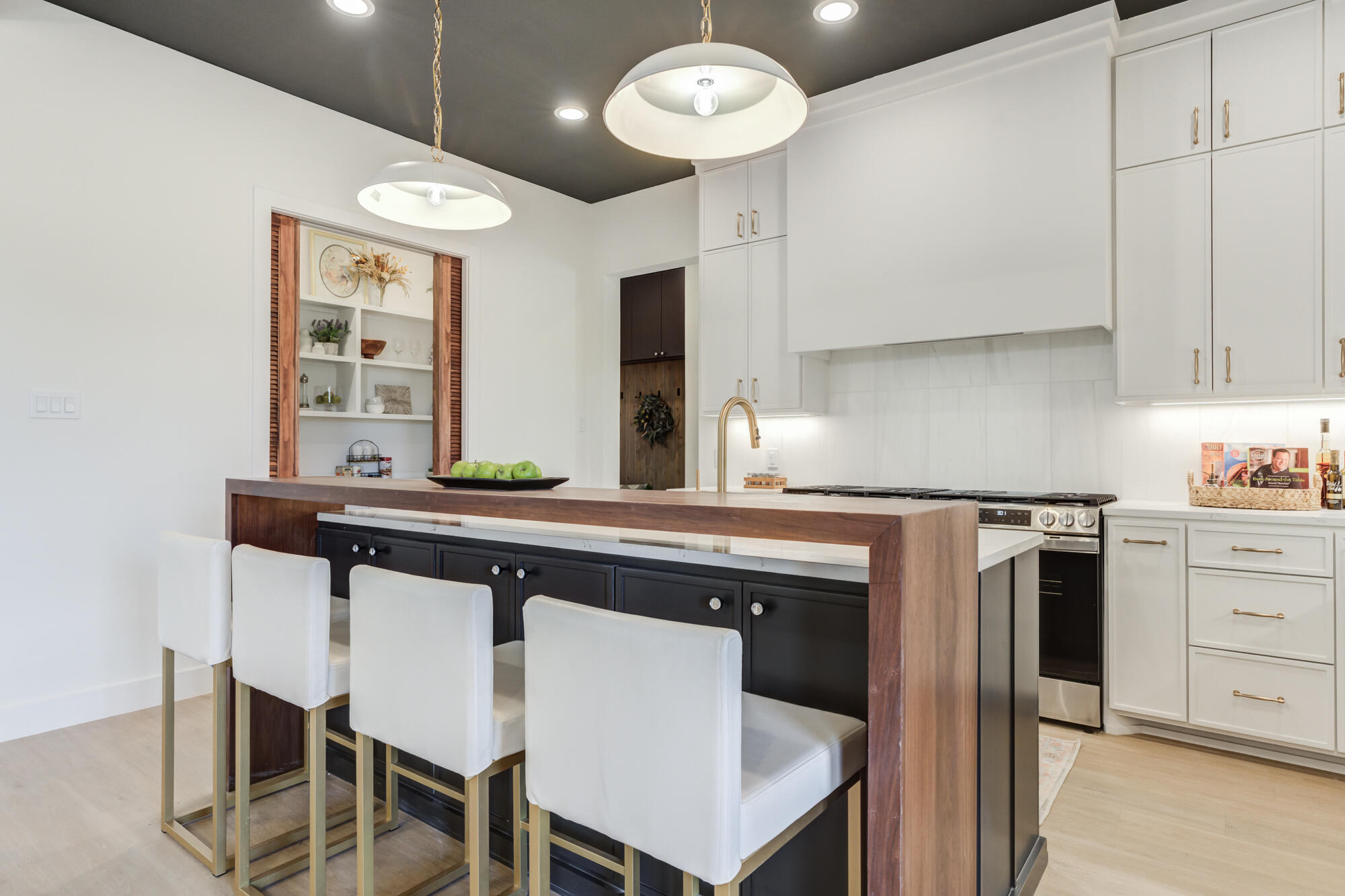 3606 144th Street Lubbock, TX 79423 - Photo 22 of 67 a kitchen with a table chairs sink and cabinets