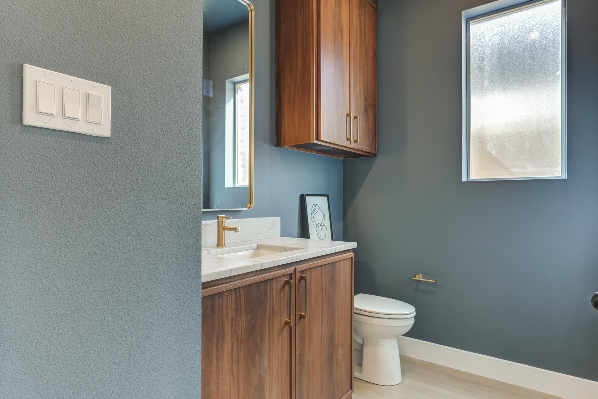3606 144th Street Lubbock, TX 79423 - Photo 26 of 67 a bathroom with a toilet sink and mirror