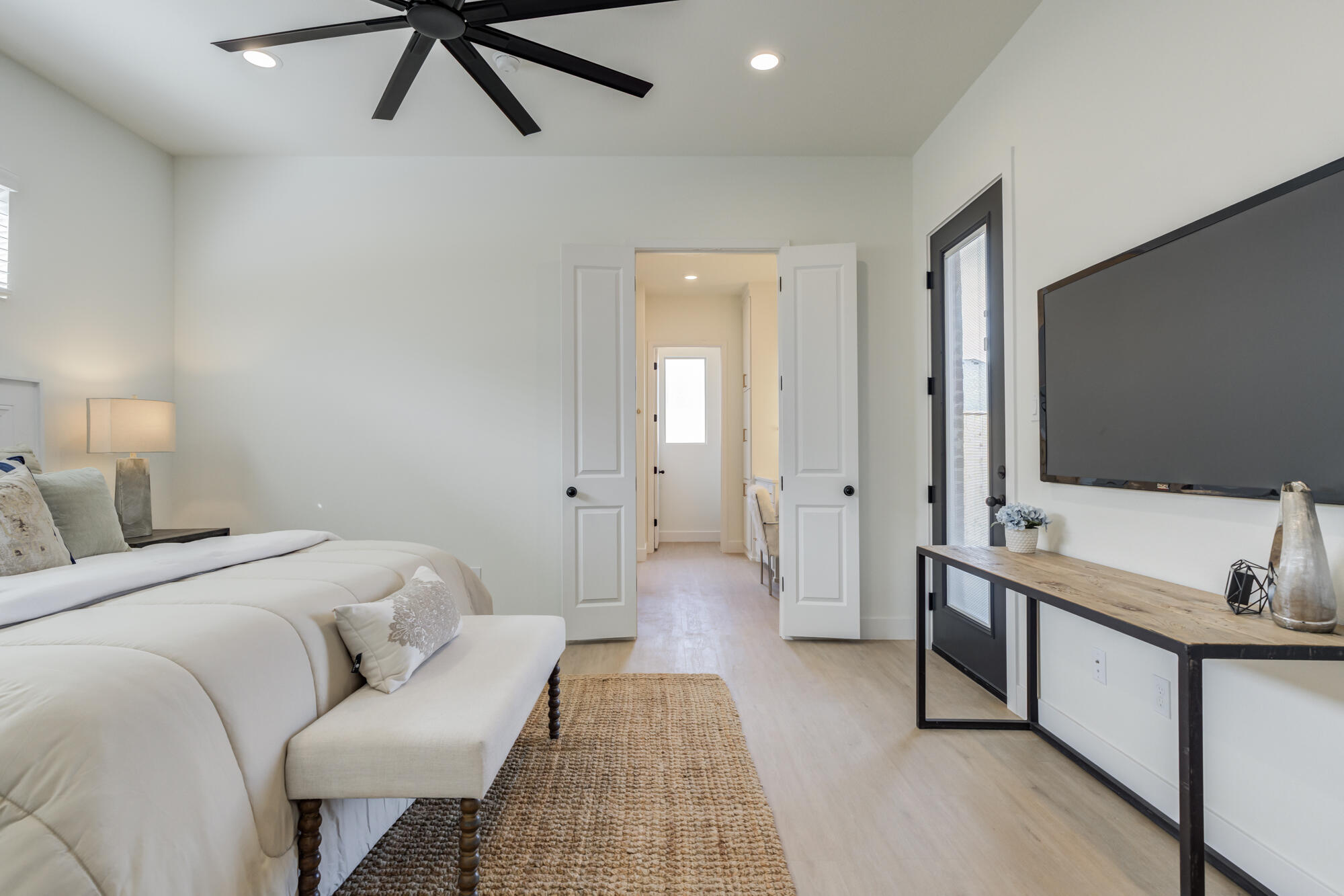 3606 144th Street Lubbock, TX 79423 - Photo 32 of 67 a bedroom with a bed and a flat screen tv