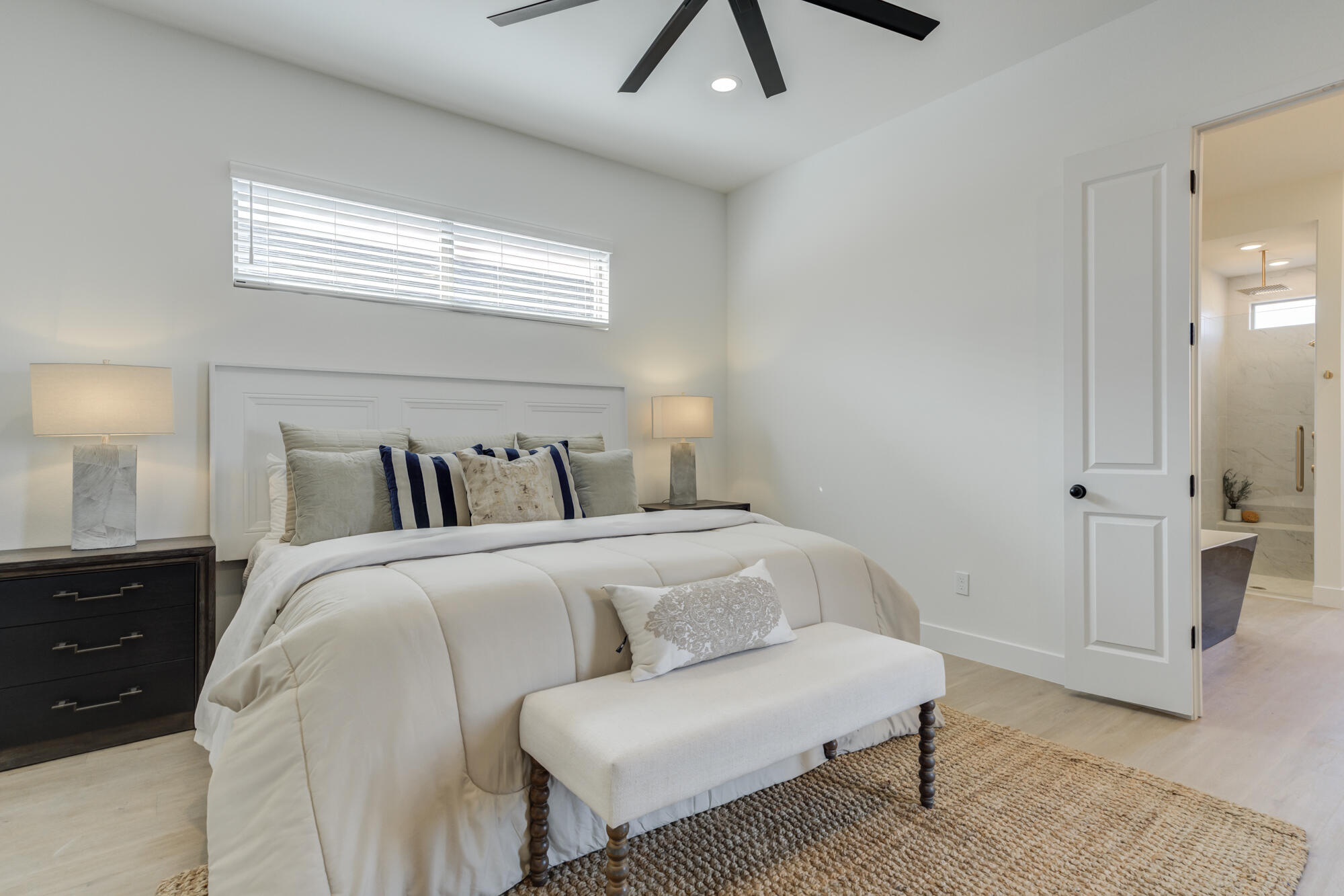 3606 144th Street Lubbock, TX 79423 - Photo 33 of 67 a spacious bedroom with a bed and a chandelier