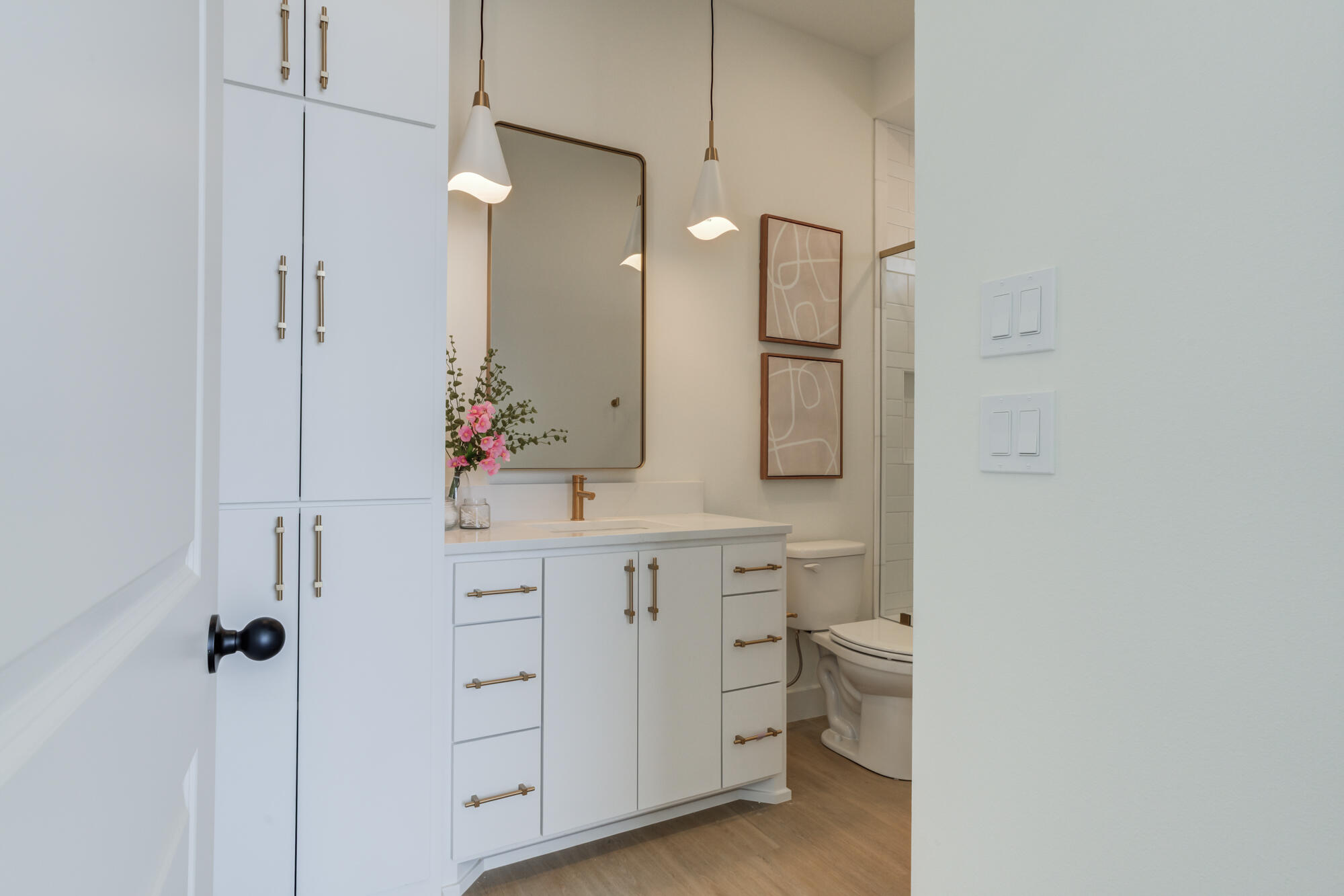 3606 144th Street Lubbock, TX 79423 - Photo 43 of 67 a spacious bathroom with a double vanity sink a mirror and a toilet